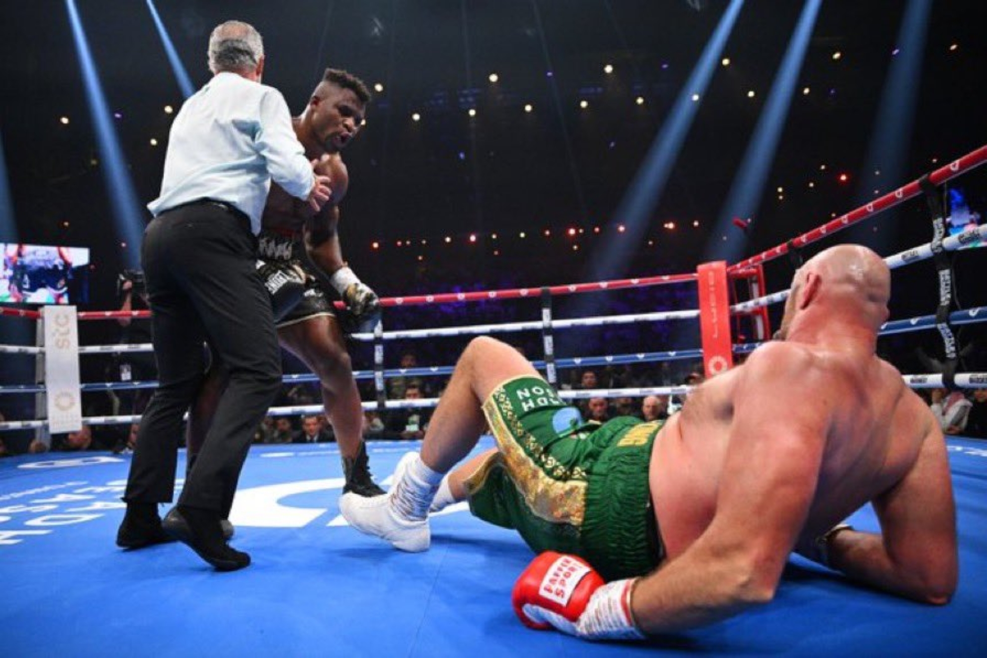 Francis Ngannou knocks Tyson Fury down
