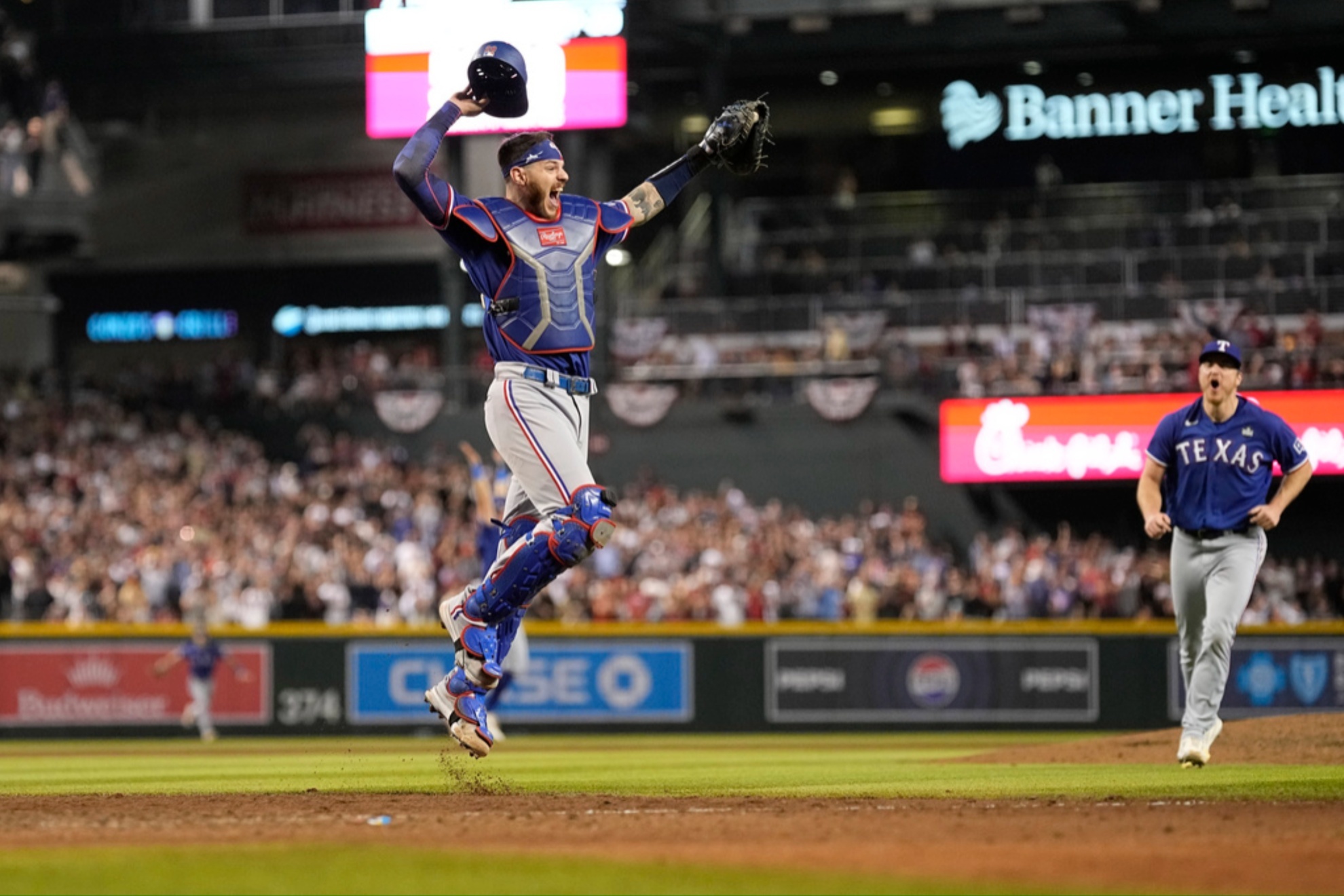 Texas Rangers catcher Jonah Heim celebrates the World Series championship.