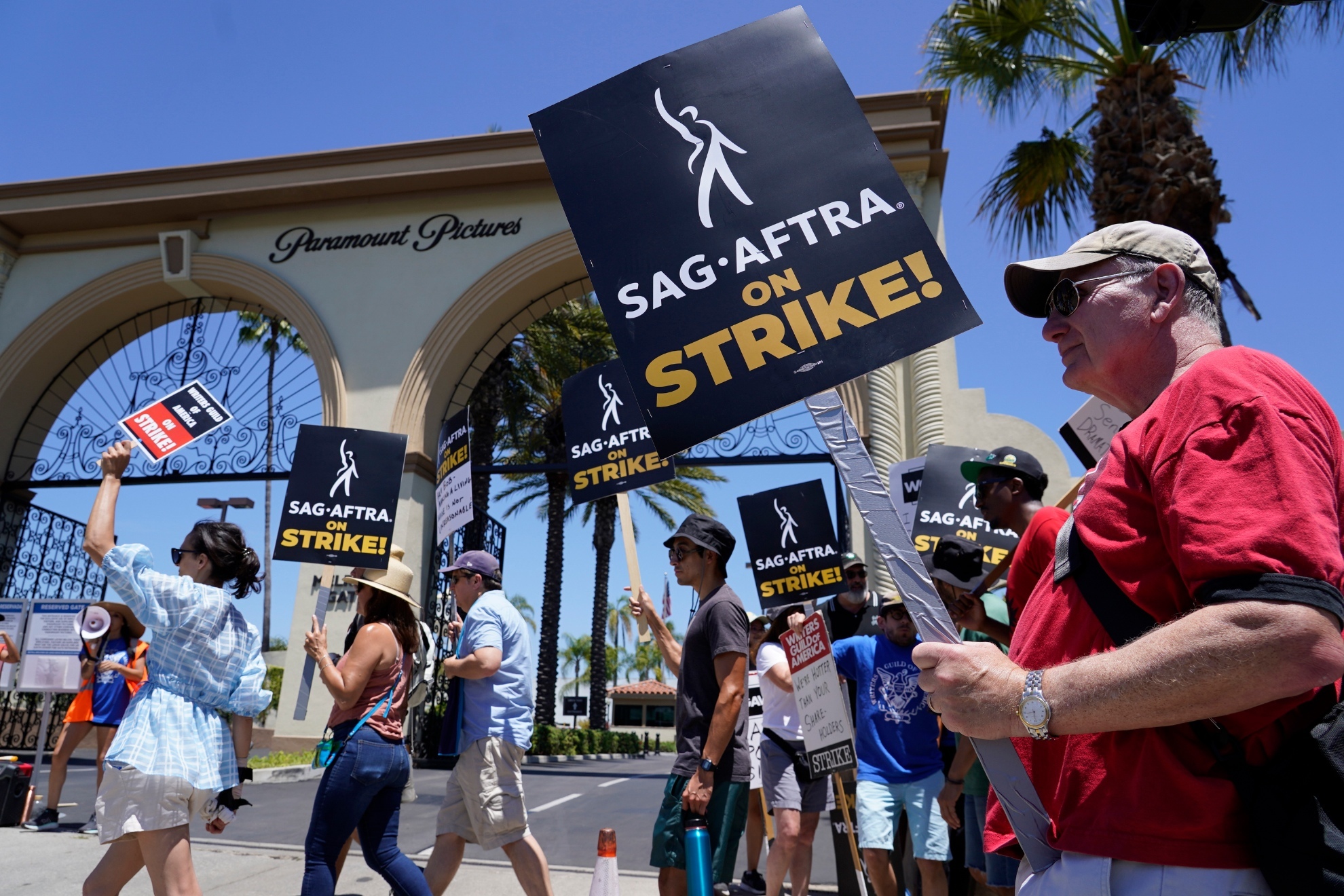SAG-AFTRA members strike against Hollywood Studios in Los Angeles