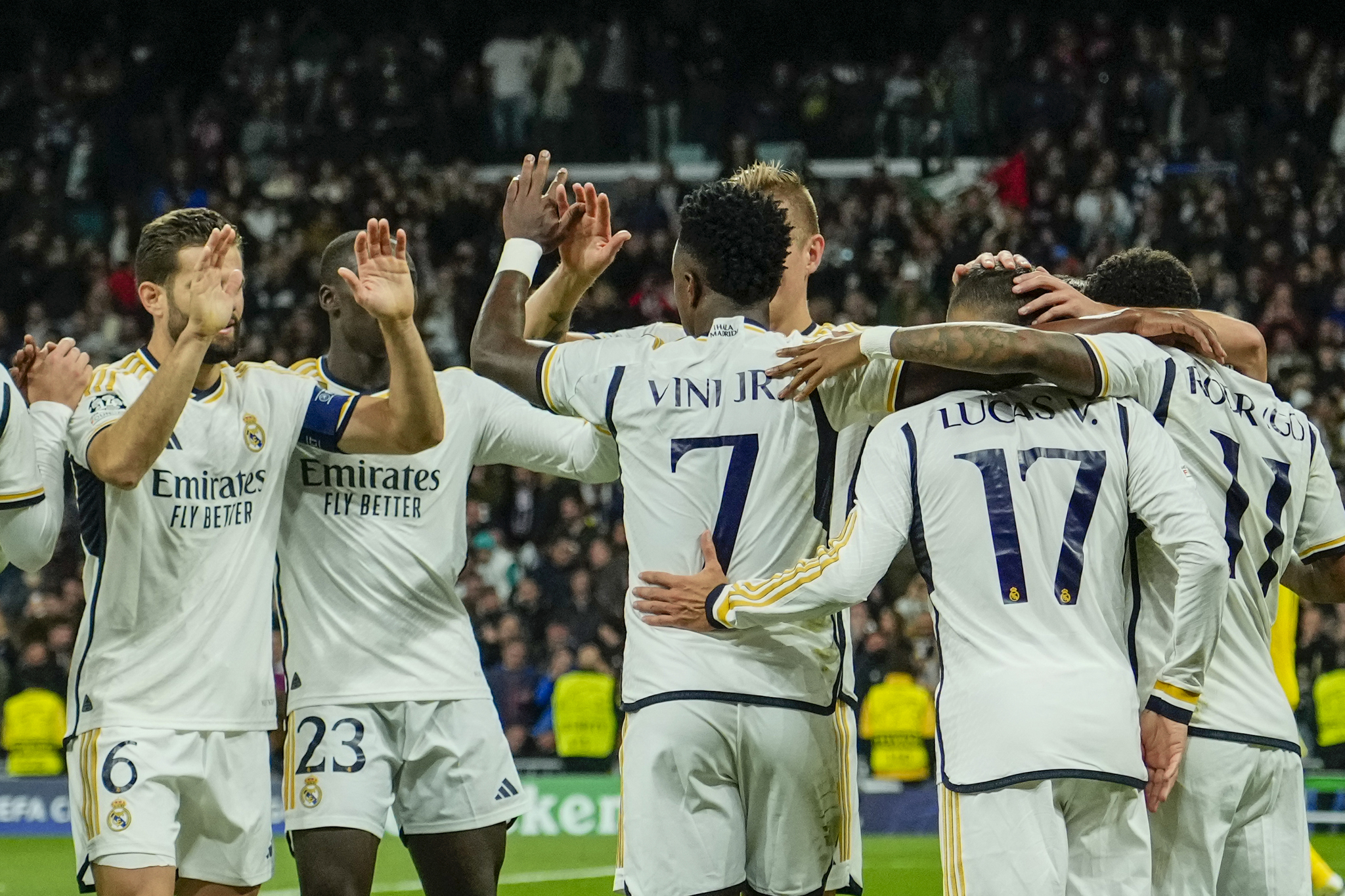 Real Madrids Vinicius Junior celebrates with teammates after scoring his sides second goal during the Champions League Group C soccer match between Real Madrid and Braga at the Santiago Bernabeu stadium in Madrid, Spain, Wednesday, Nov. 8, 2023. (AP Photo/Jose Breton)