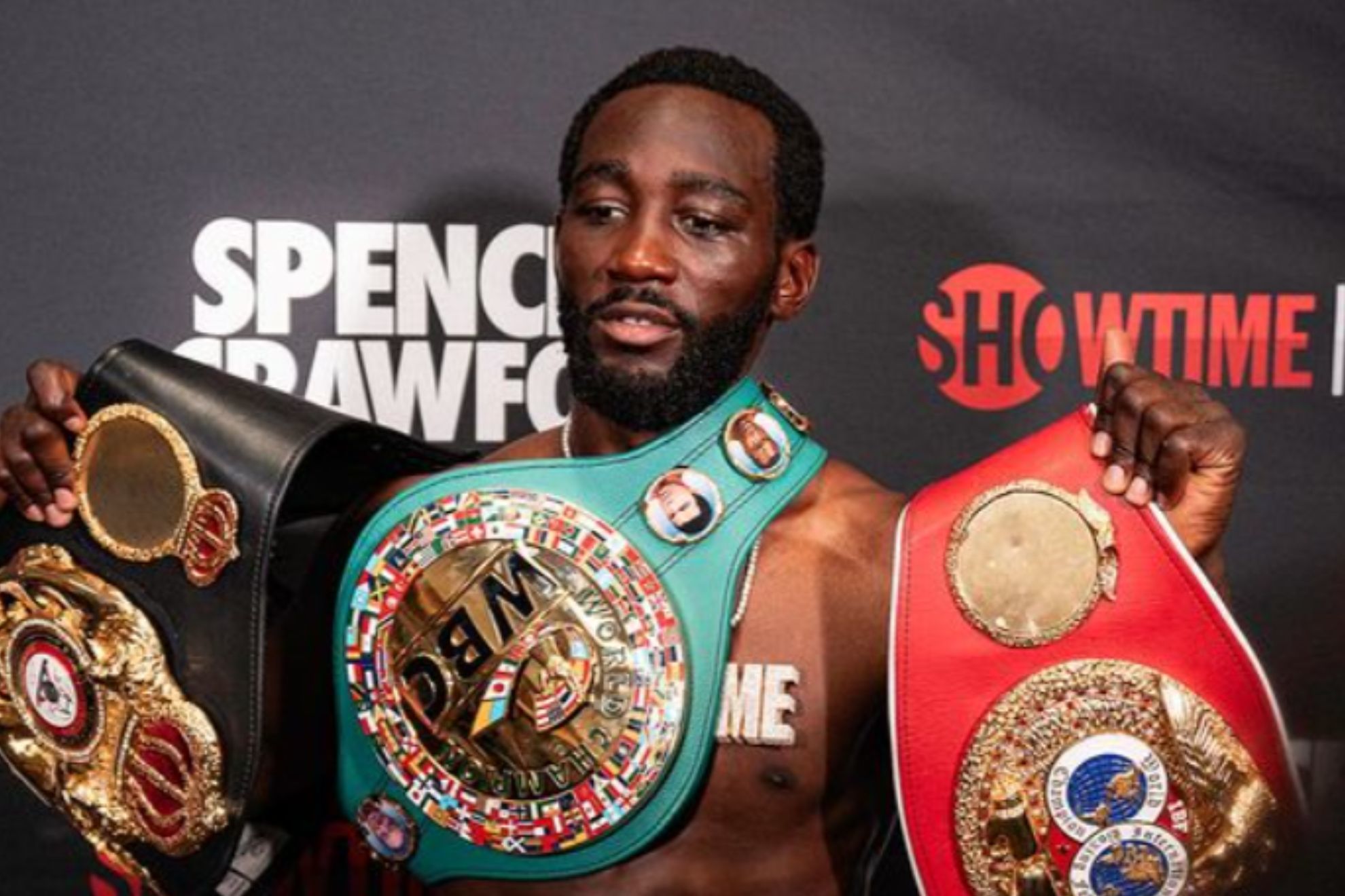 Terence Crawford posed with his championship belts after defeating Errol Spence Jr. back in July of 2023.