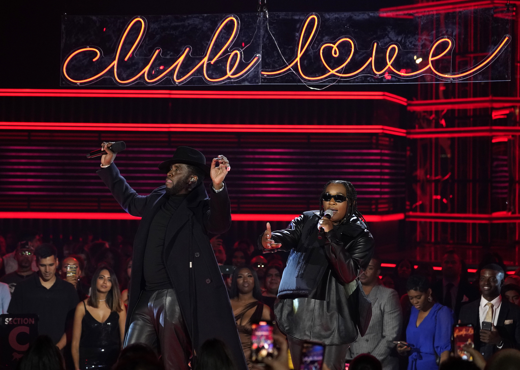 Sean Diddy Combs, left, and Jozzy speak onstage at the Billboard Music Awards on Sunday, May 15, 2022, at the MGM Grand Garden Arena in Las Vegas.