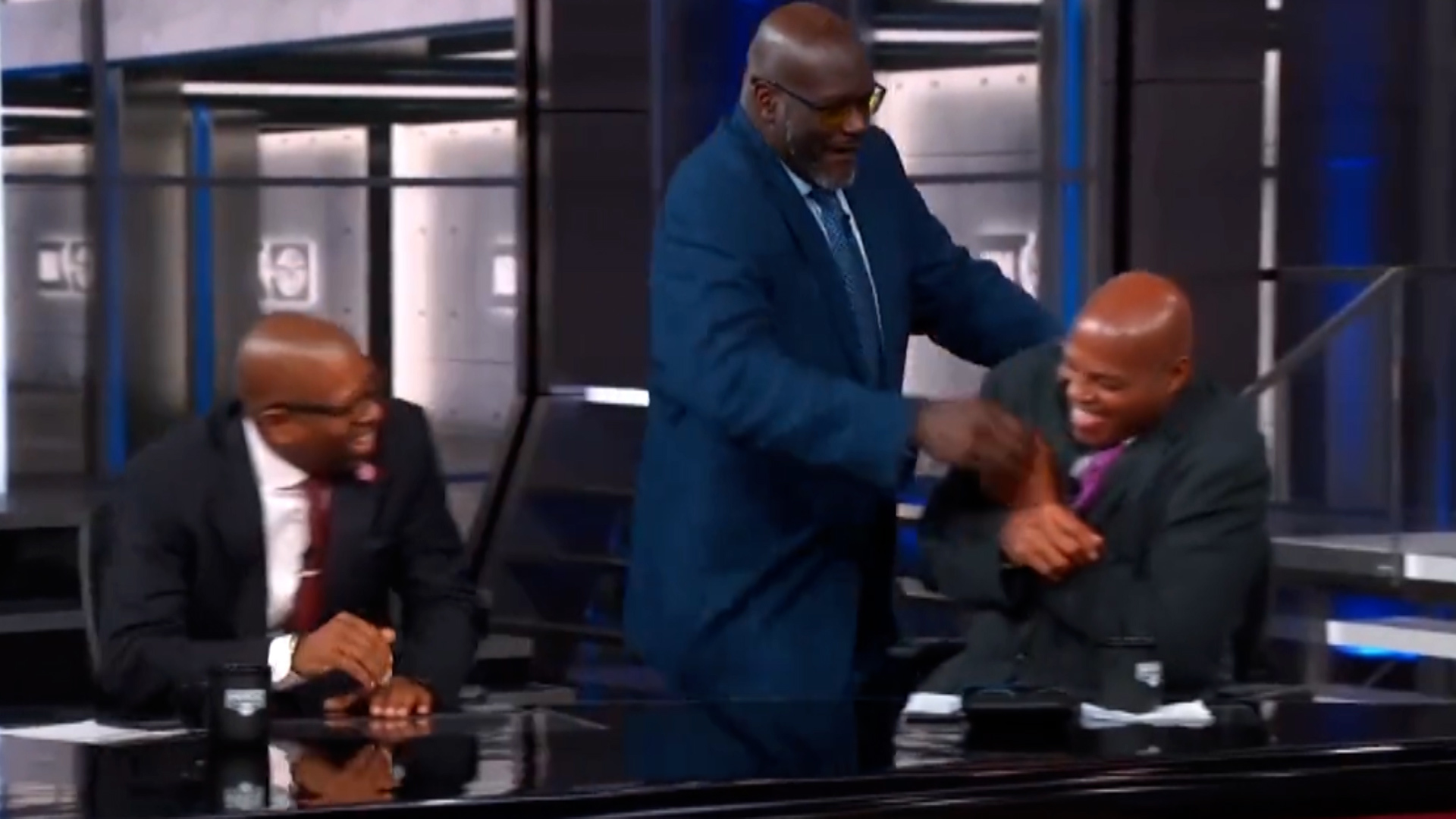 Shaquille ONeal puts Charles Barkley in a headlock as they  poke fun at Draymond Green and Rudy Gobert