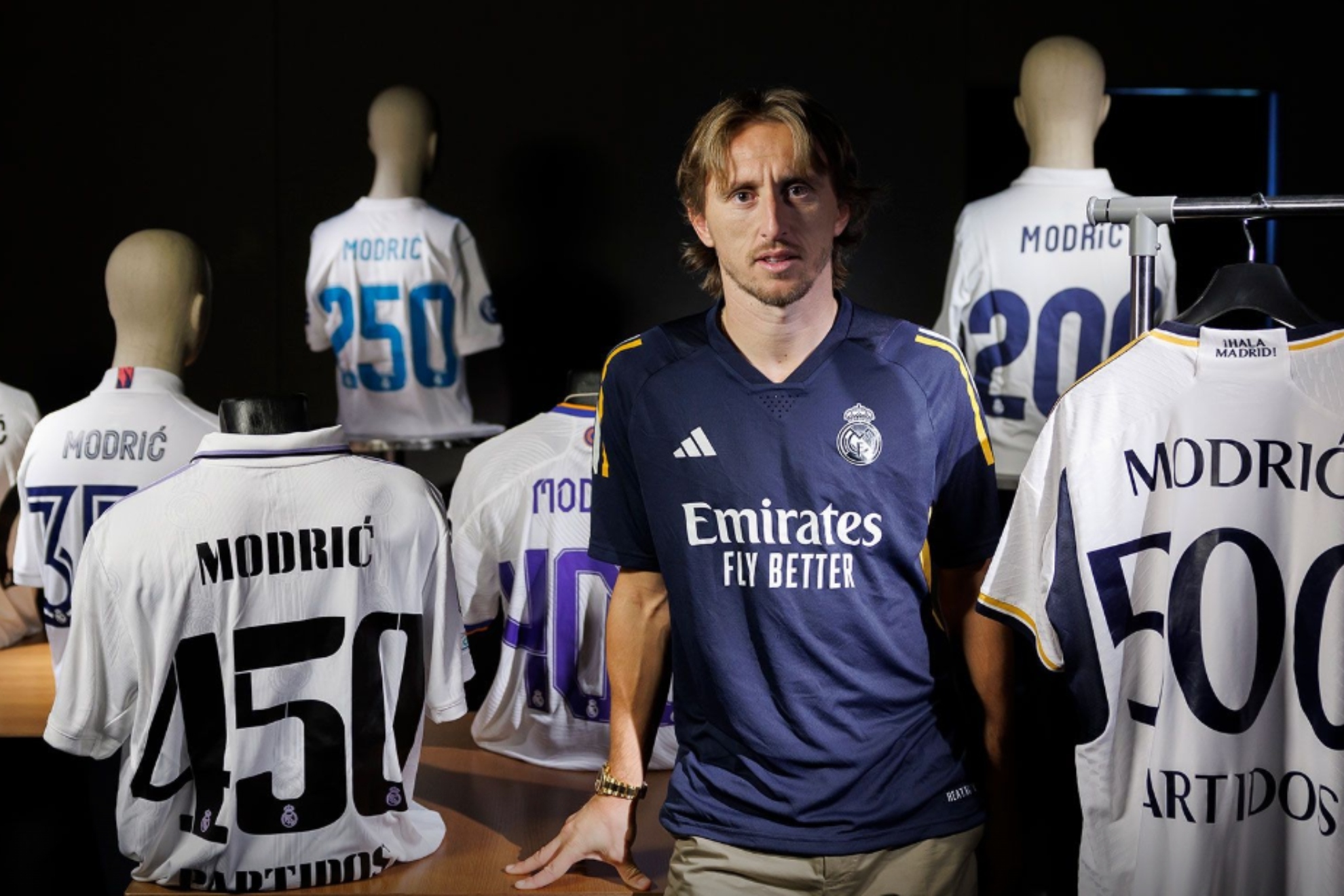 Modric, surrounded by the commemorative shirts of the matches played with Real Madrid