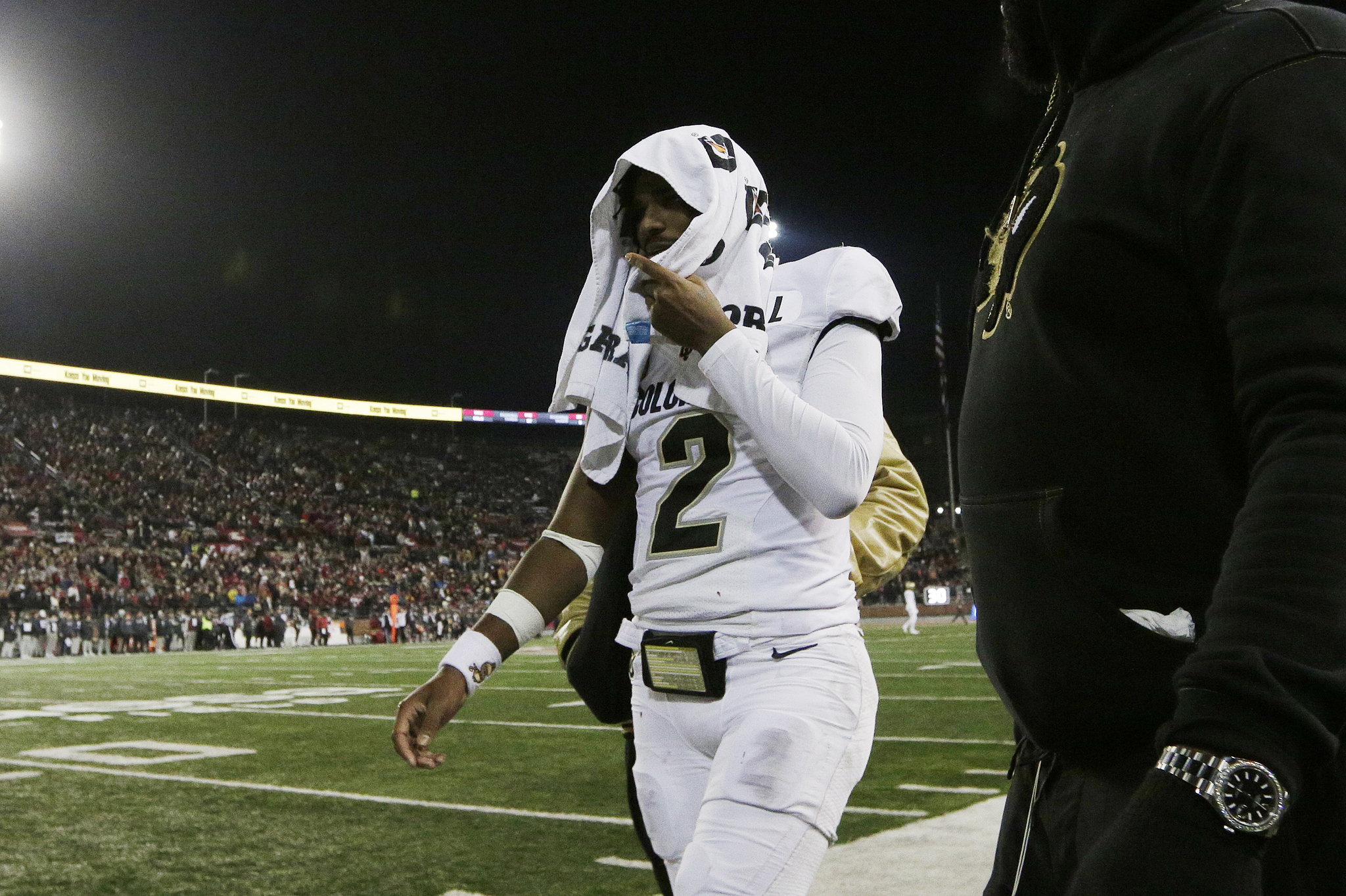 Colorado quarterback Shedeur Sanders (2) walks toward the locker room during the first half of the team's NCAA college football game against Washington State.