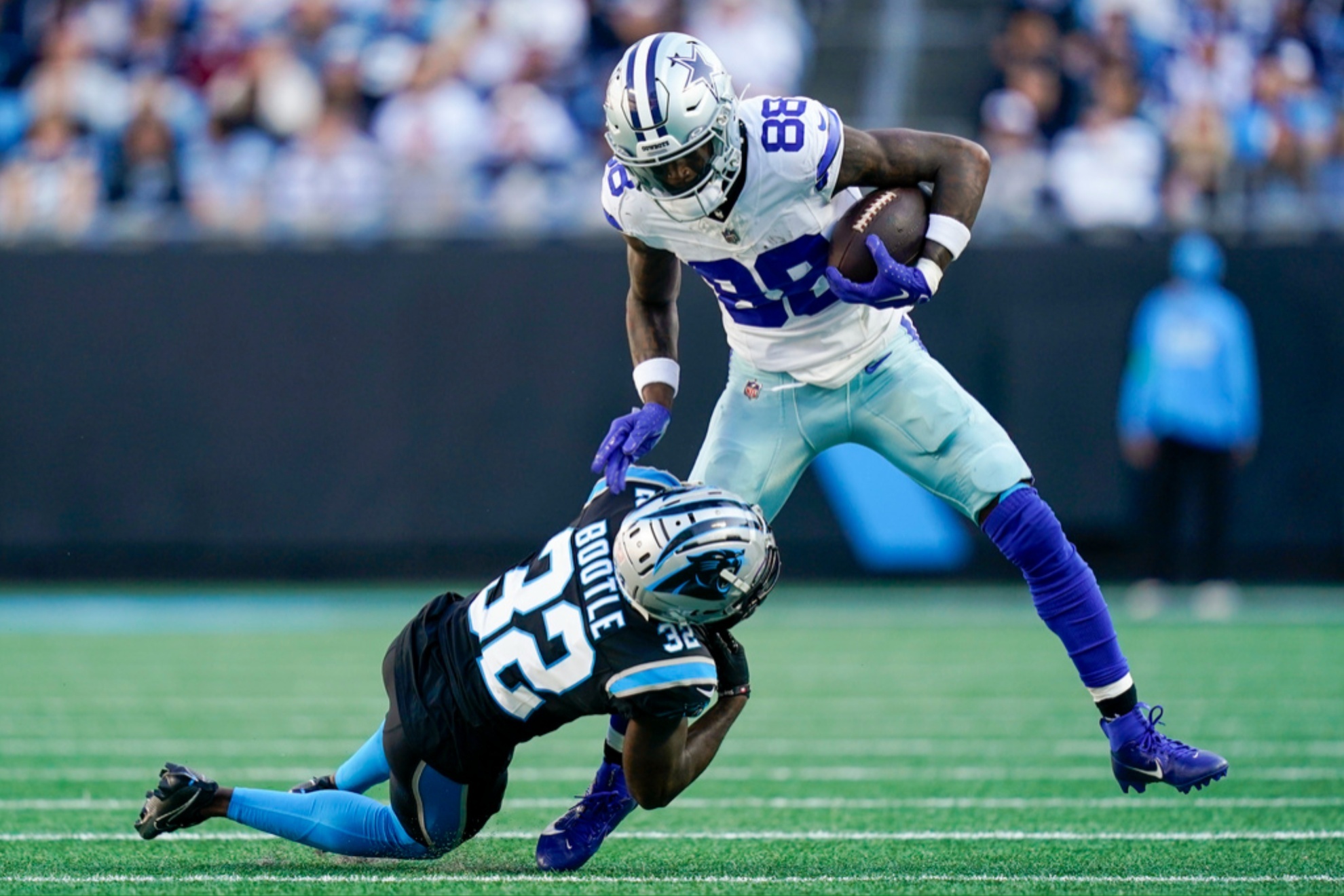 CeeDee Lamb (88) tackled by Dicaprio Bootle (32) at the Cowboys-Panthers game.