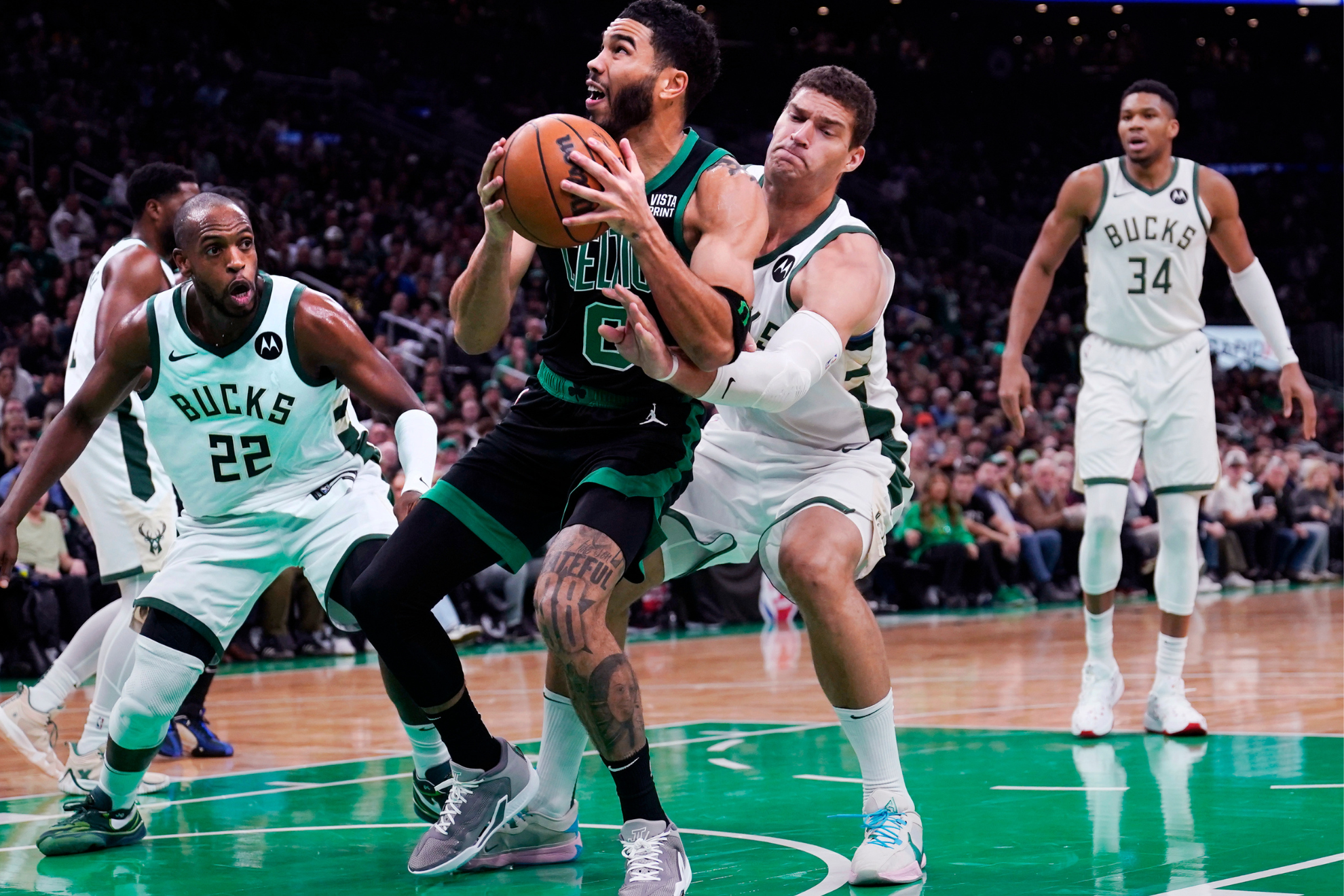 Jayson Tatum and the Celtics withstood a fourth-quarter push from Giannis and the Bucks.