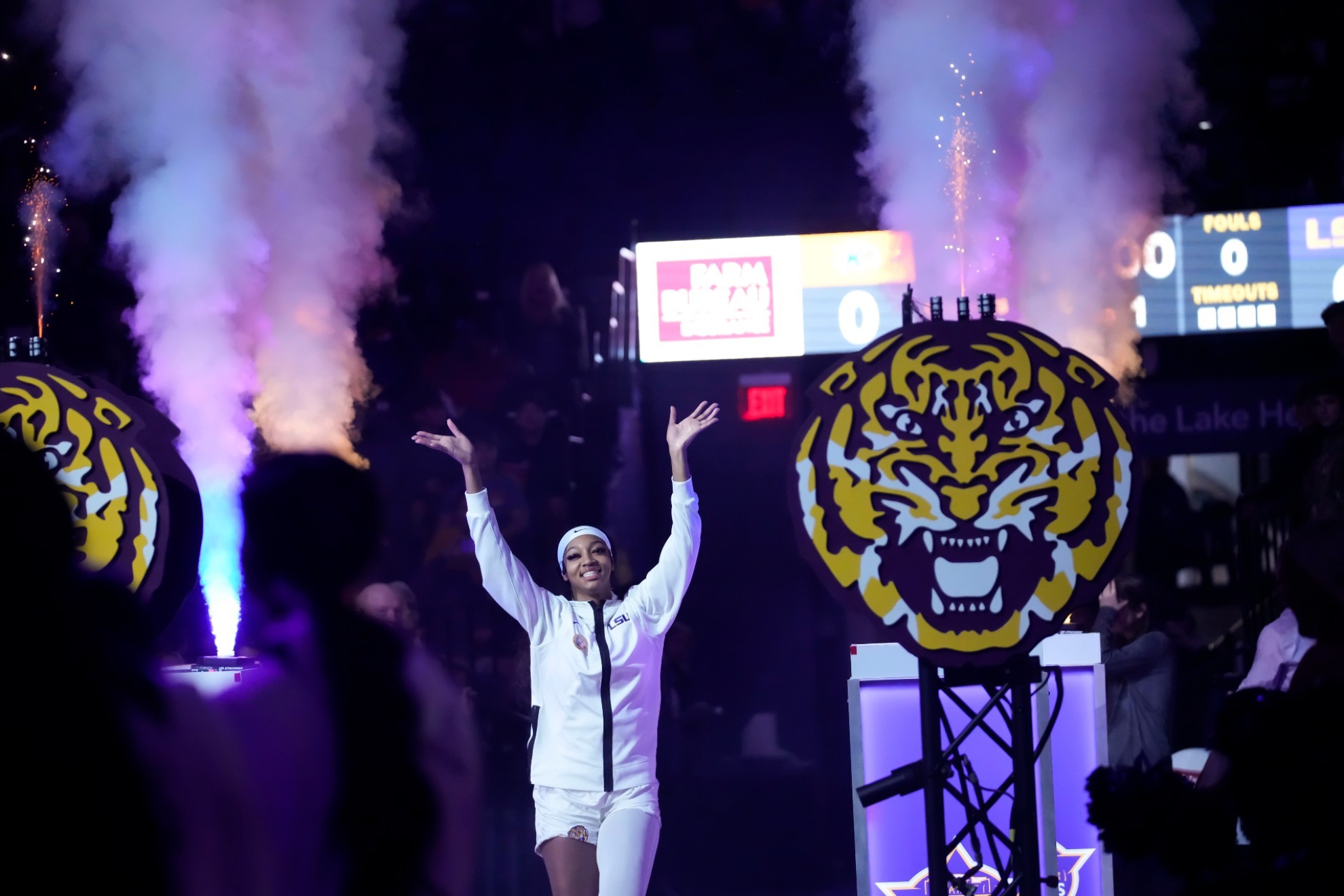 LSU forward Angel Reese waves to the crowd as she is introduced before an NCAA college basketball game