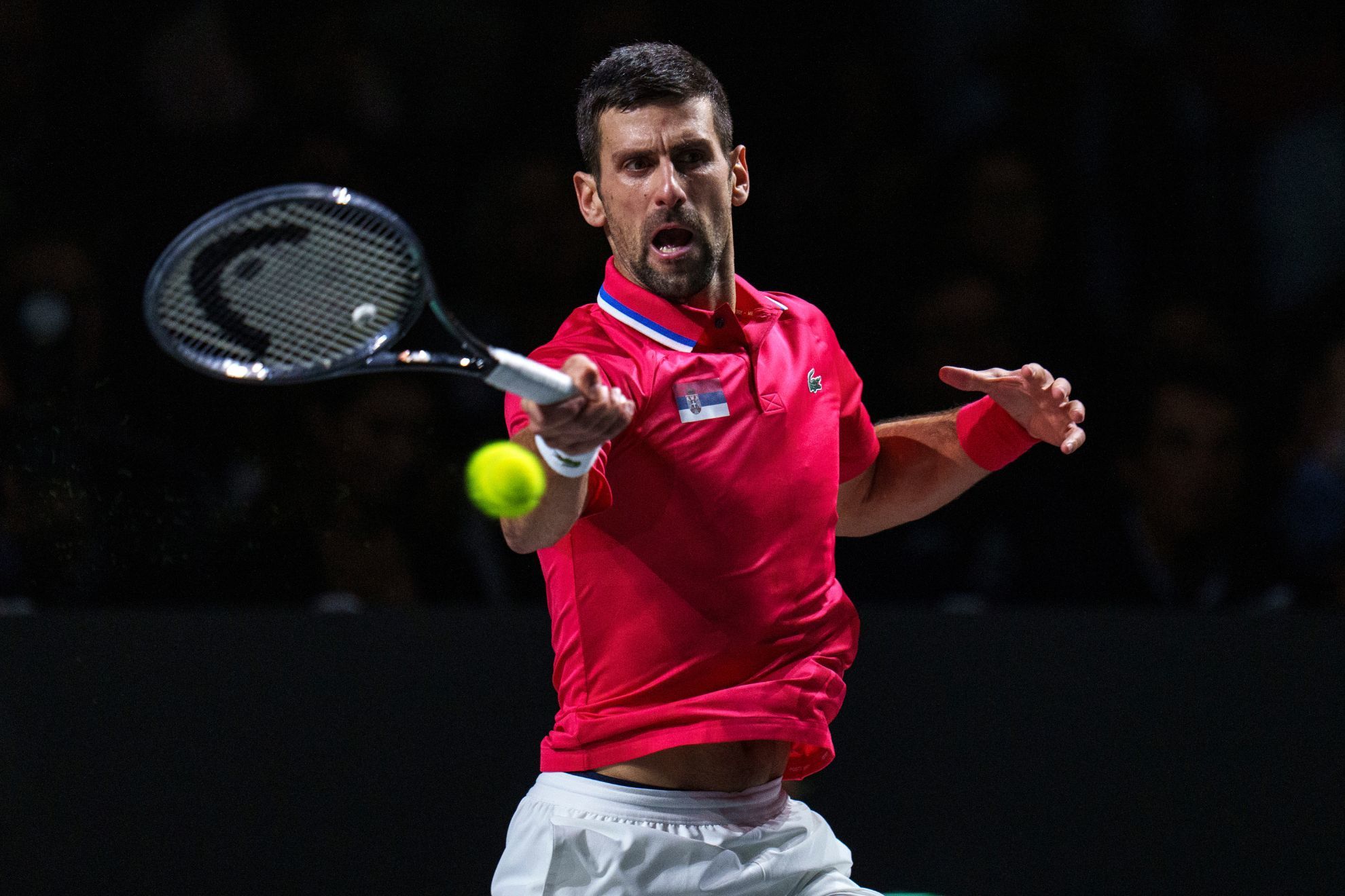 Novak Djokovic returns the ball against Jannik Sinner