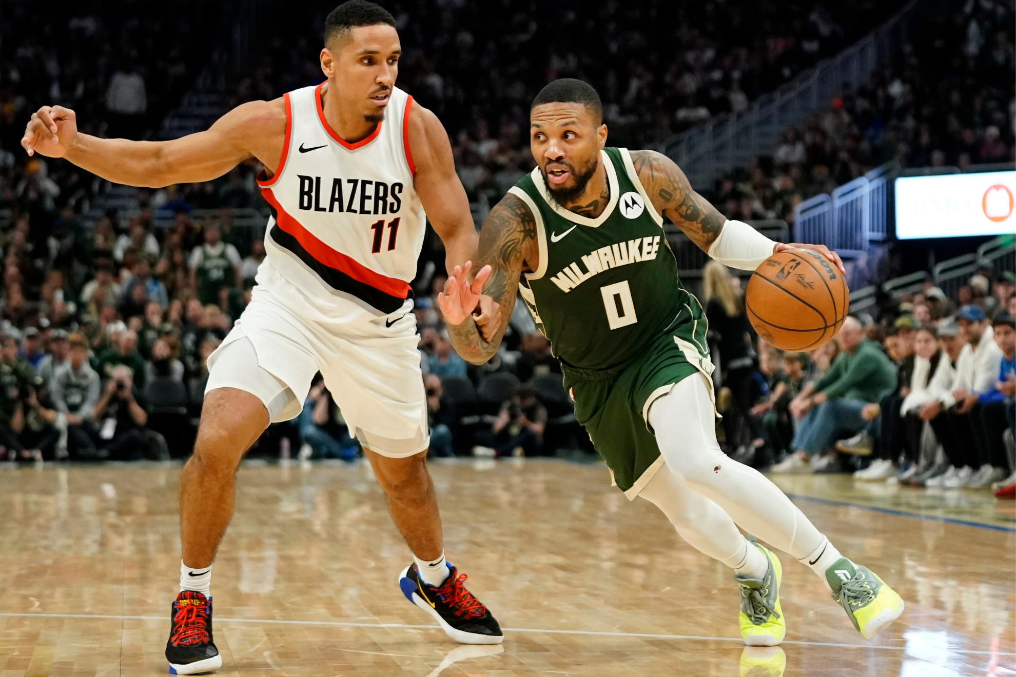 Lillard (right) scored 31 points in his first game against Portland.