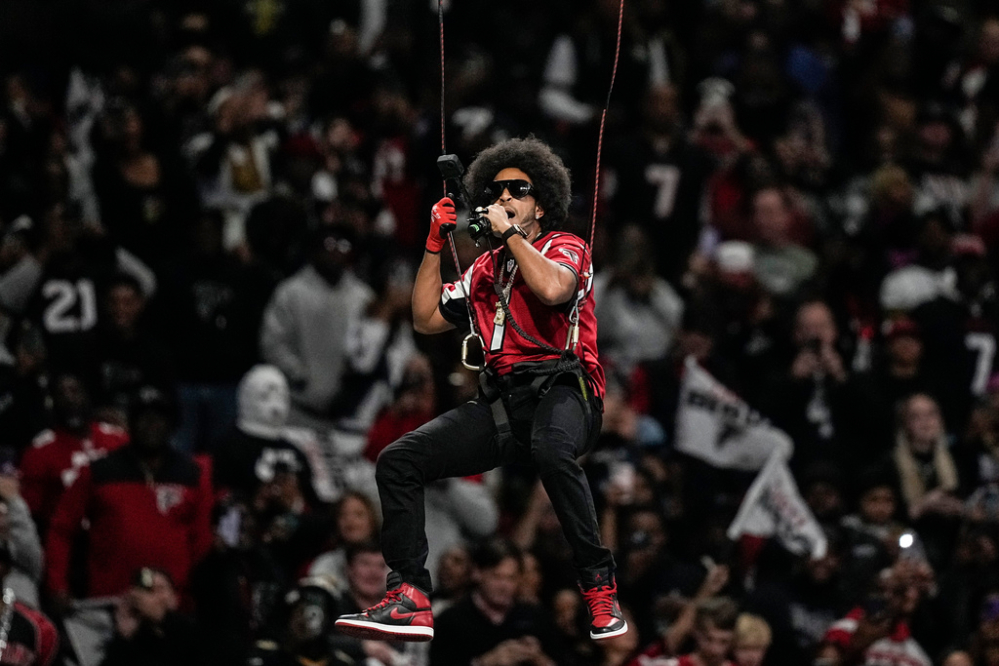 Ludacris shocks fans by ziplining into Mercedes Benz stadium during 3Q of Falcons game