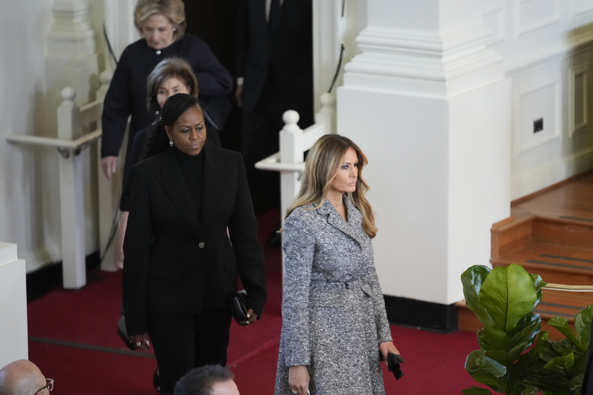Former first ladies Melania Trump, Michelle Obama, Laura Bush and Hillary Clinton, arrive to attend a tribute service for former first lady Rosalynn Carter