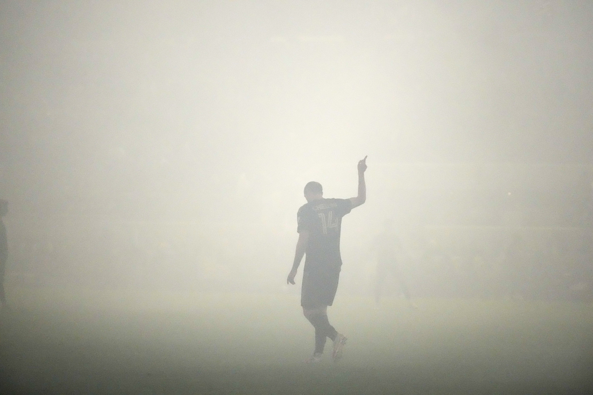 LAFC defender Giorgio Chiellini gestures amid smoke during the MLS Western Conference final.