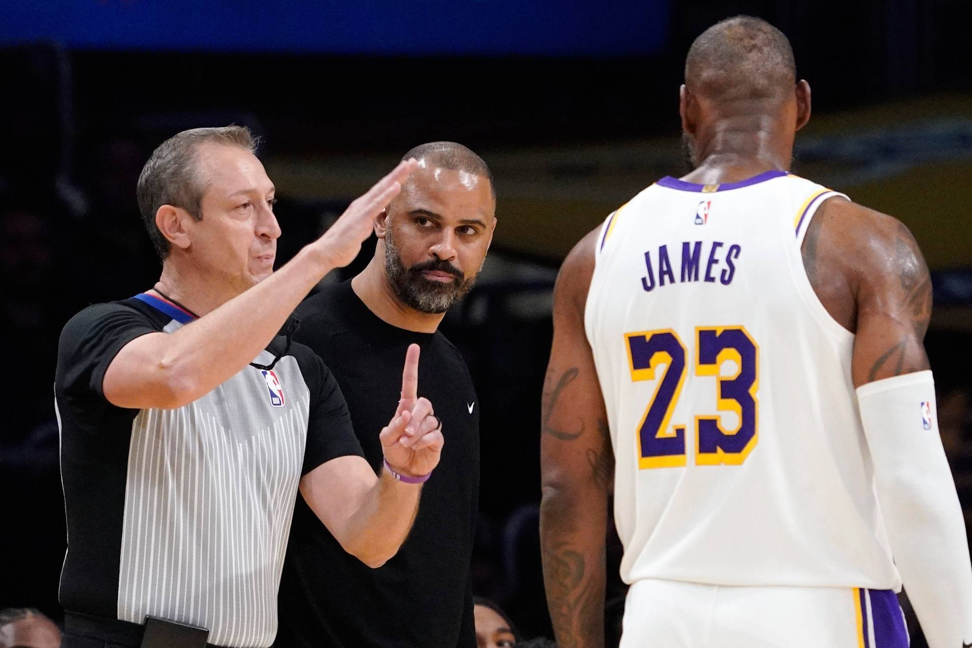 Referee J.T. Orr assesses technical fouls to Houston Rockets head coach About Ime Udoka /