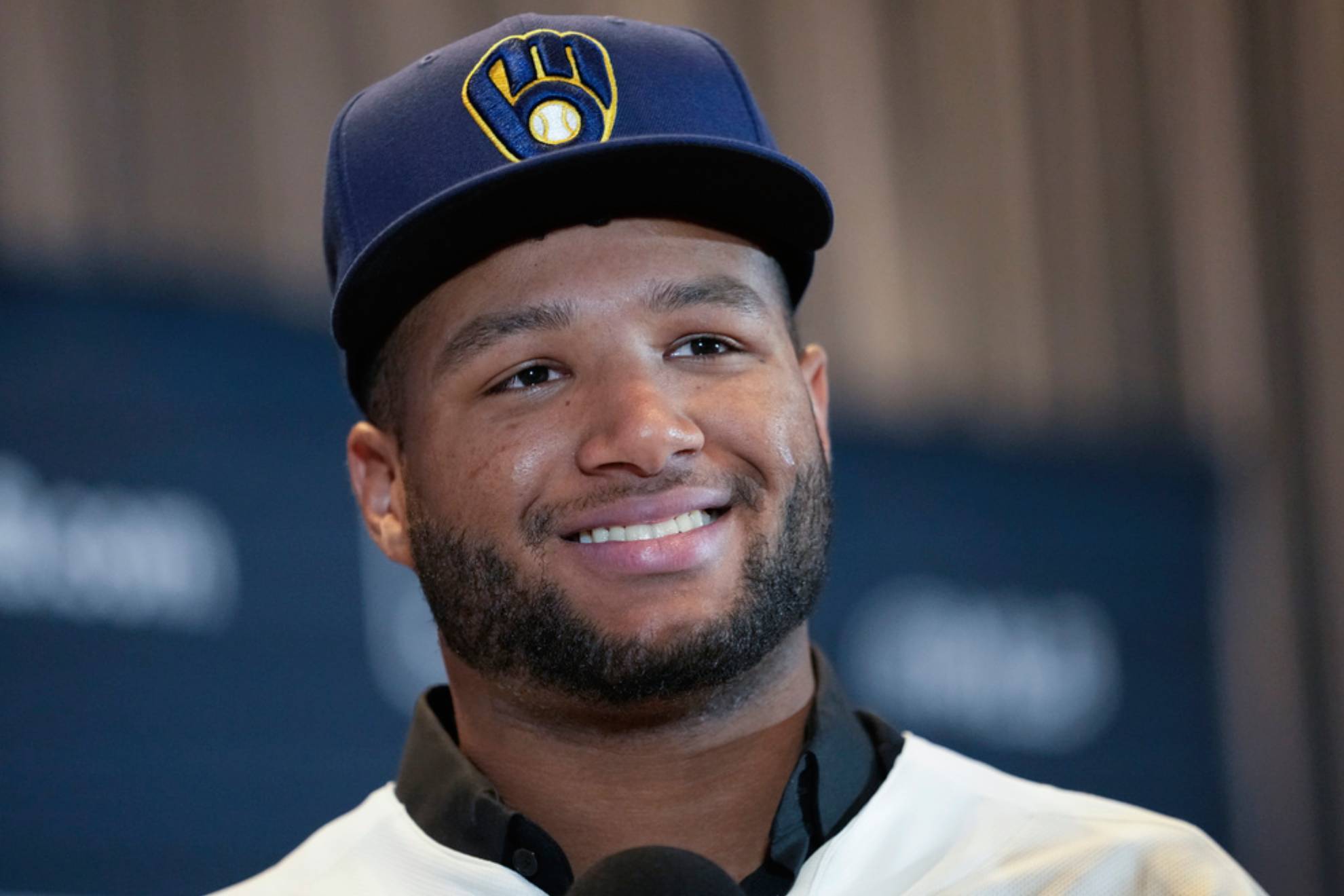 Milwaukee Brewers outfielder Jackson Chourio responds to questions following a news conference /