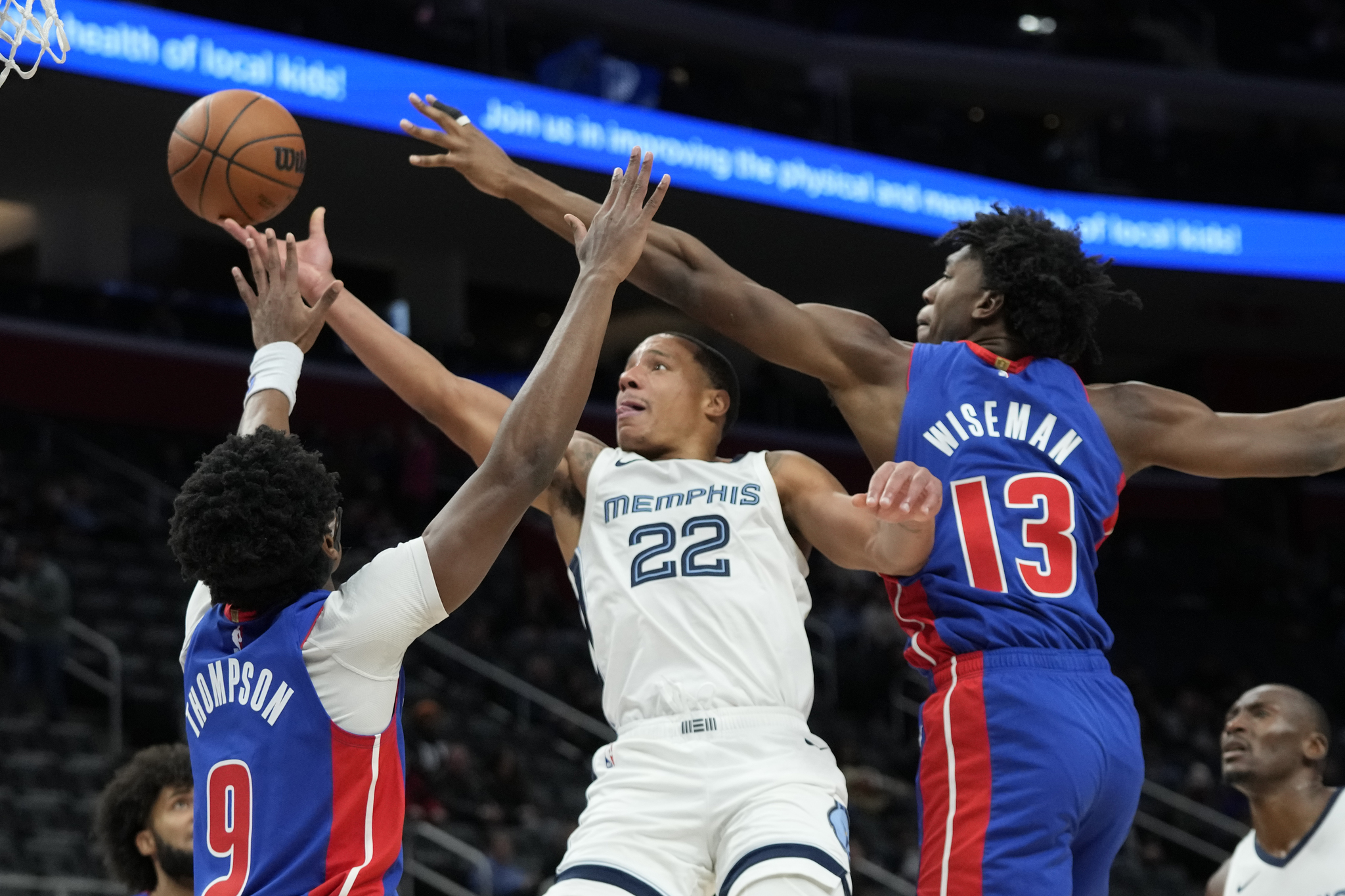 Desmond Bane (center) dropped 49 points on the Pistons to spearhead Memphis comeback win.