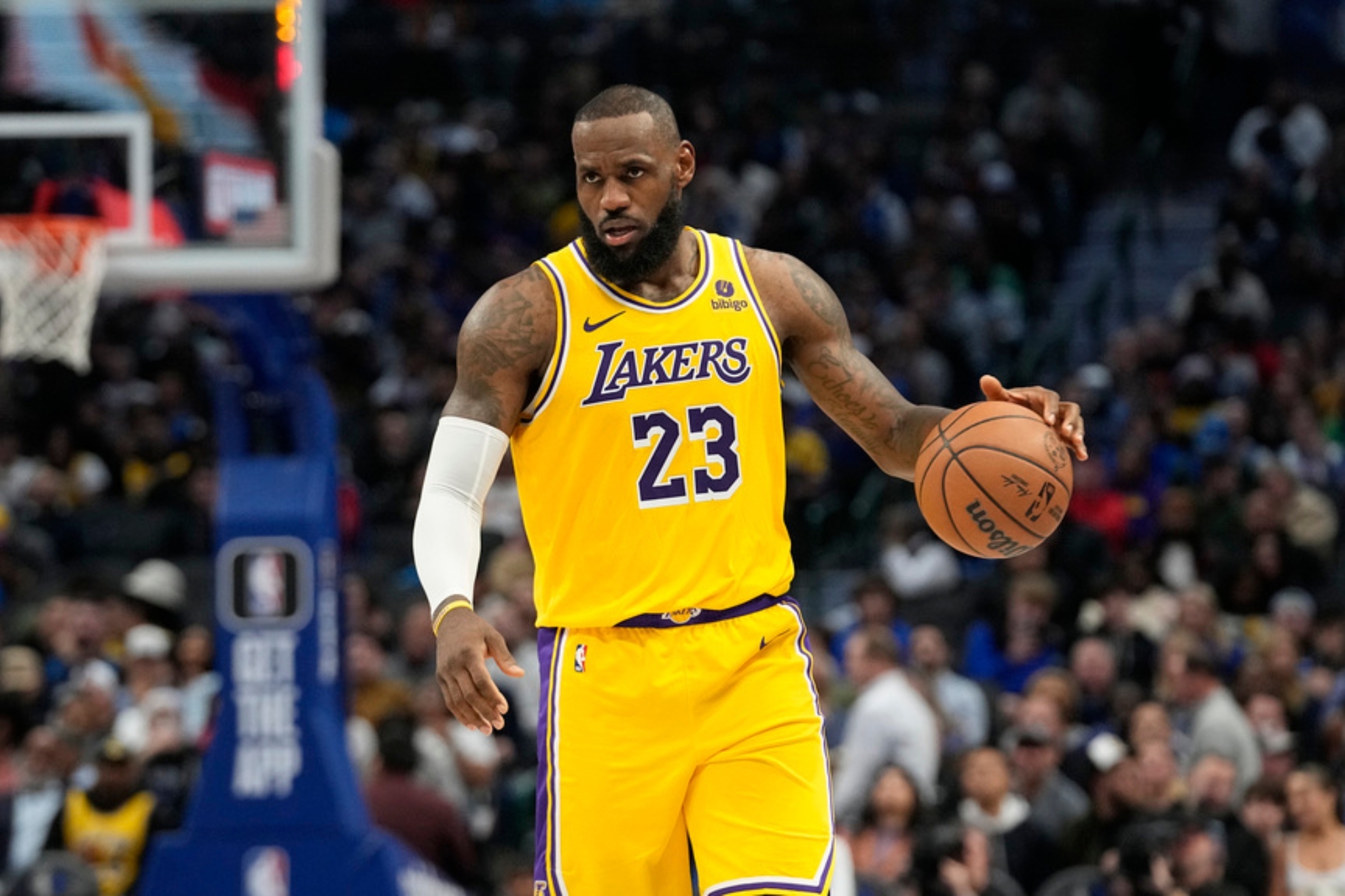 Los Angeles Lakers forward LeBron James dribbles during the second half of an NBA basketball game against the Dallas Mavericks in Dallas, Tuesday, Dec. 12, 2023. (AP Photo/LM Otero)