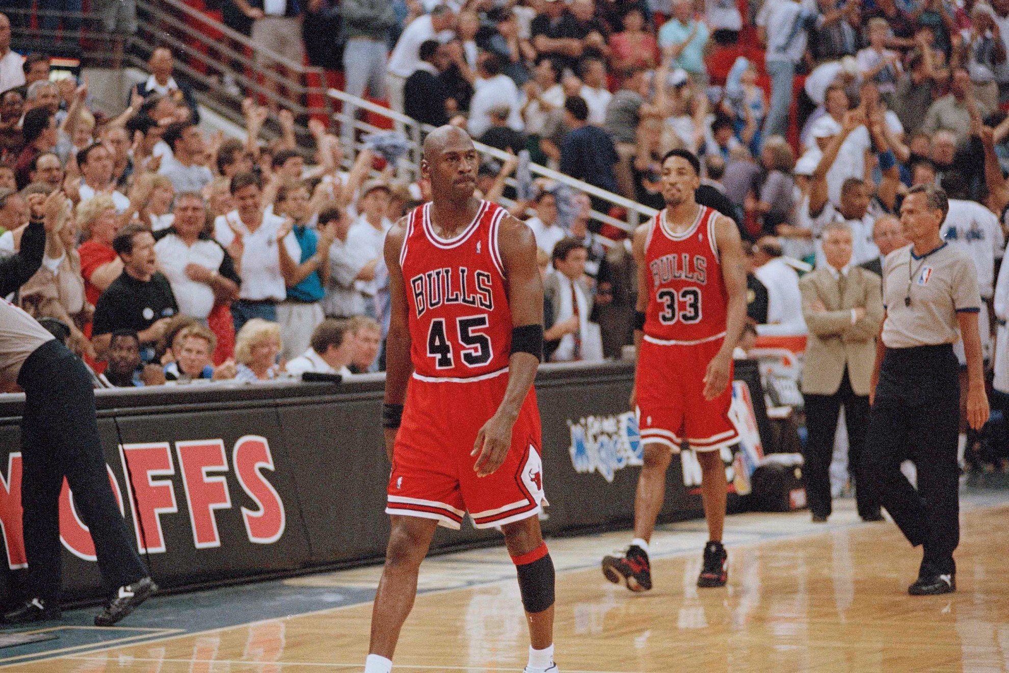 Michael Jordan walking in front of Scottie Pippen