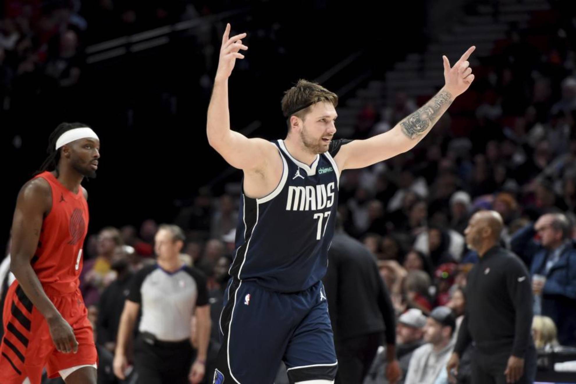 Luka Doncic celebrates one of his three-pointers against Blazers