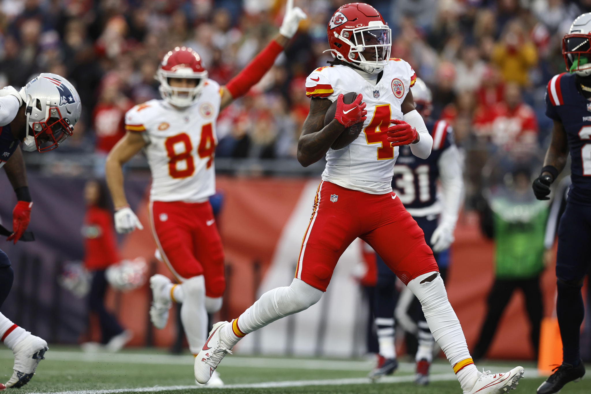 Kansas City Chiefs wide receiver Rashee Rice (4) enters the end zone for a touchdown as wide receiver Justin Watson (84) celebrates during the first half of an NFL football game against the New England Patriots, Sunday, Dec. 17, 2023, in Foxborough, Mass. (AP Photo/Michael Dwyer)
