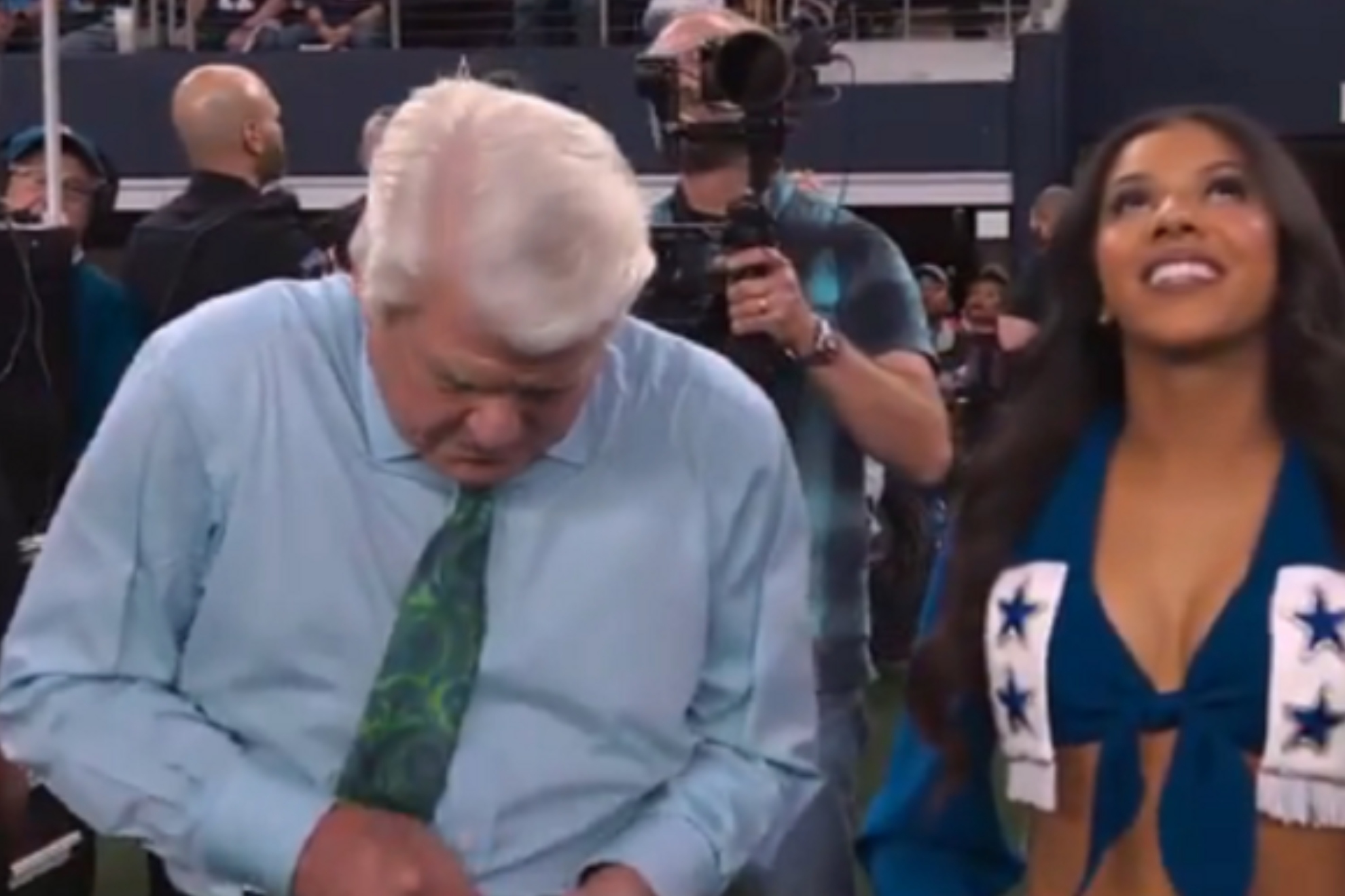 Cowboy fans laugh at Jimmy Johnson after unfortunate camera moment next to cheerleader during honor ceremony