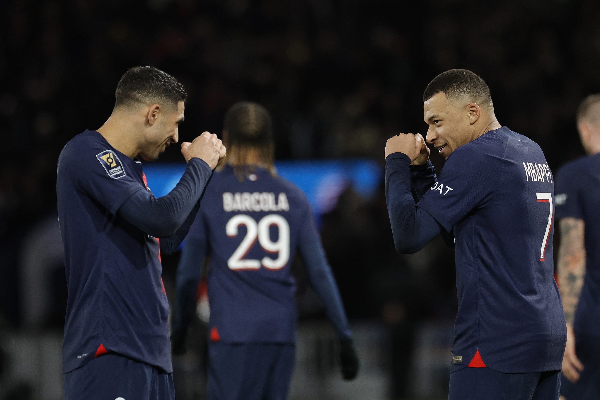 PSGs Kylian Mbappe (R) celebrates with teammate Achraf Hakimi (L) after scoring