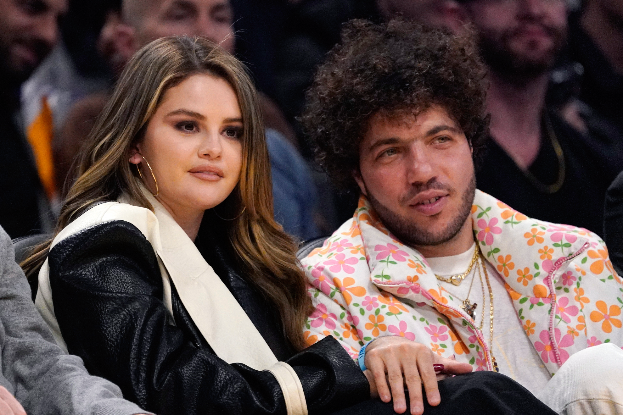 Selena Gomez gets saved from press bombardment by new boyfriend Benny Blanco at Lakers game