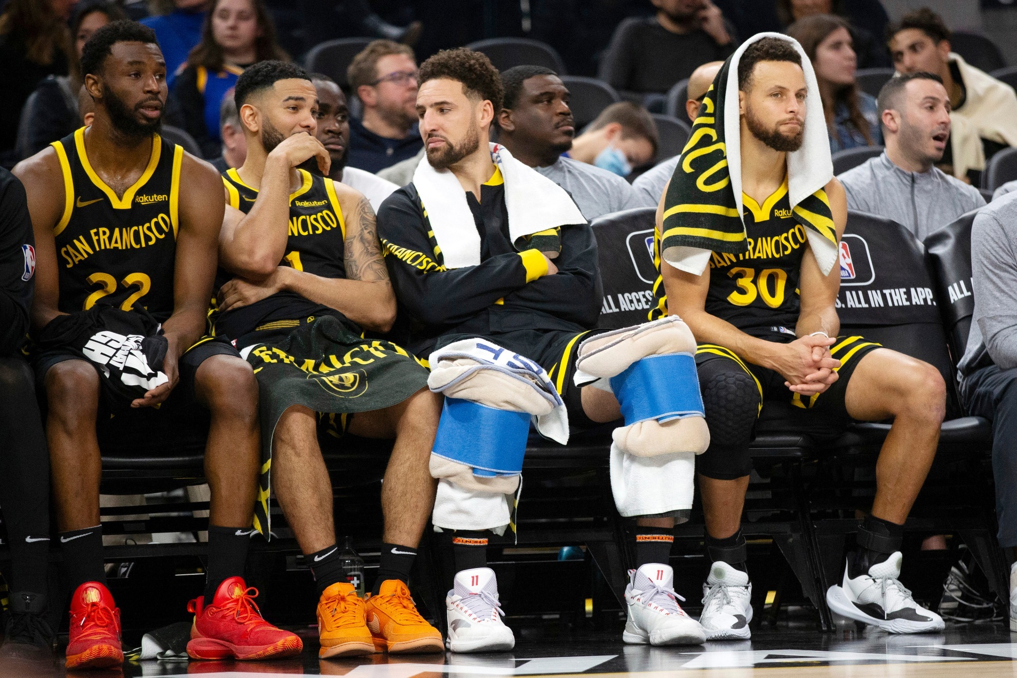 Golden State Warriors players on the bench