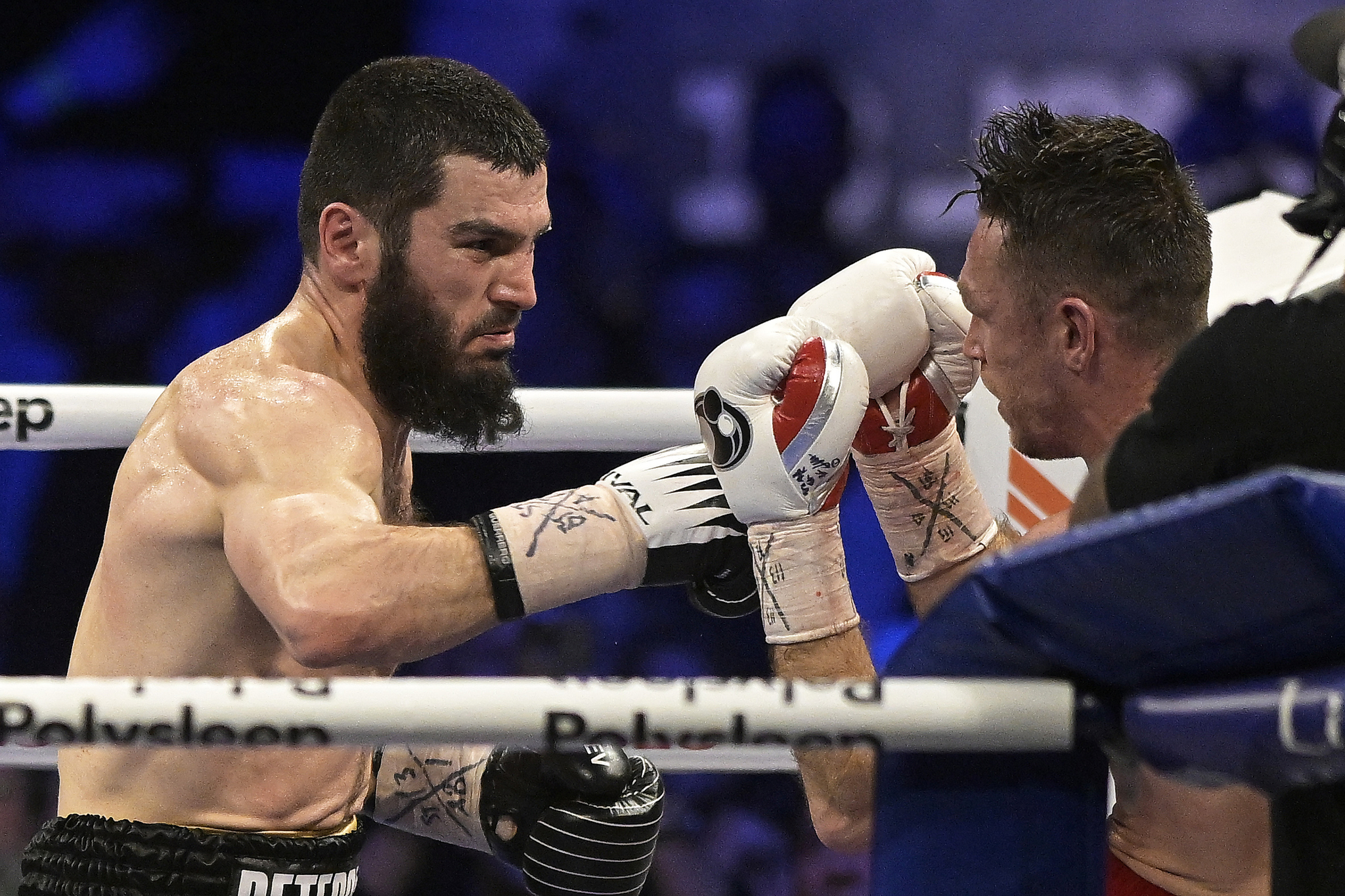 Artur Beterbiev, left, tries to hit Callum Smith with a right