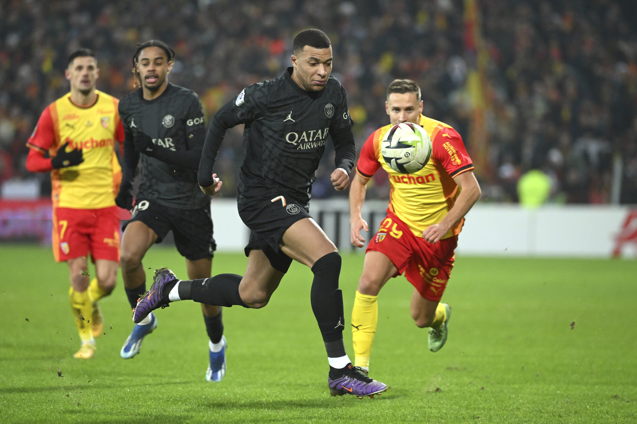 PSGs Kylian Mbappe controls the ball against Lens