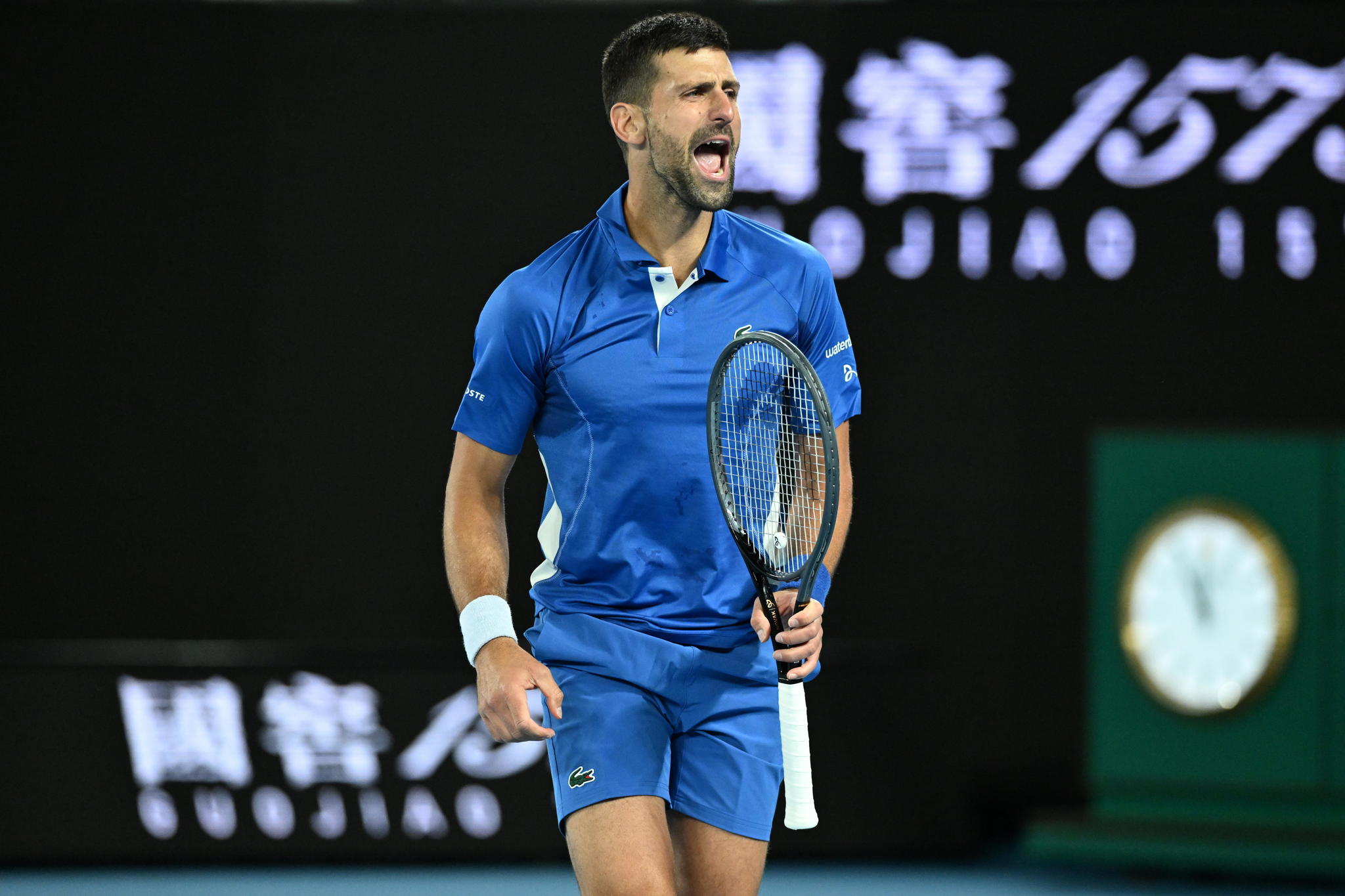 Novak Djokovic celebrates during his win over Alexei Popyrin