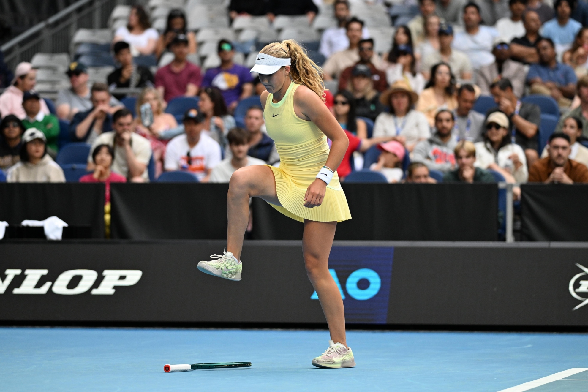 Andreeva throws her racket.