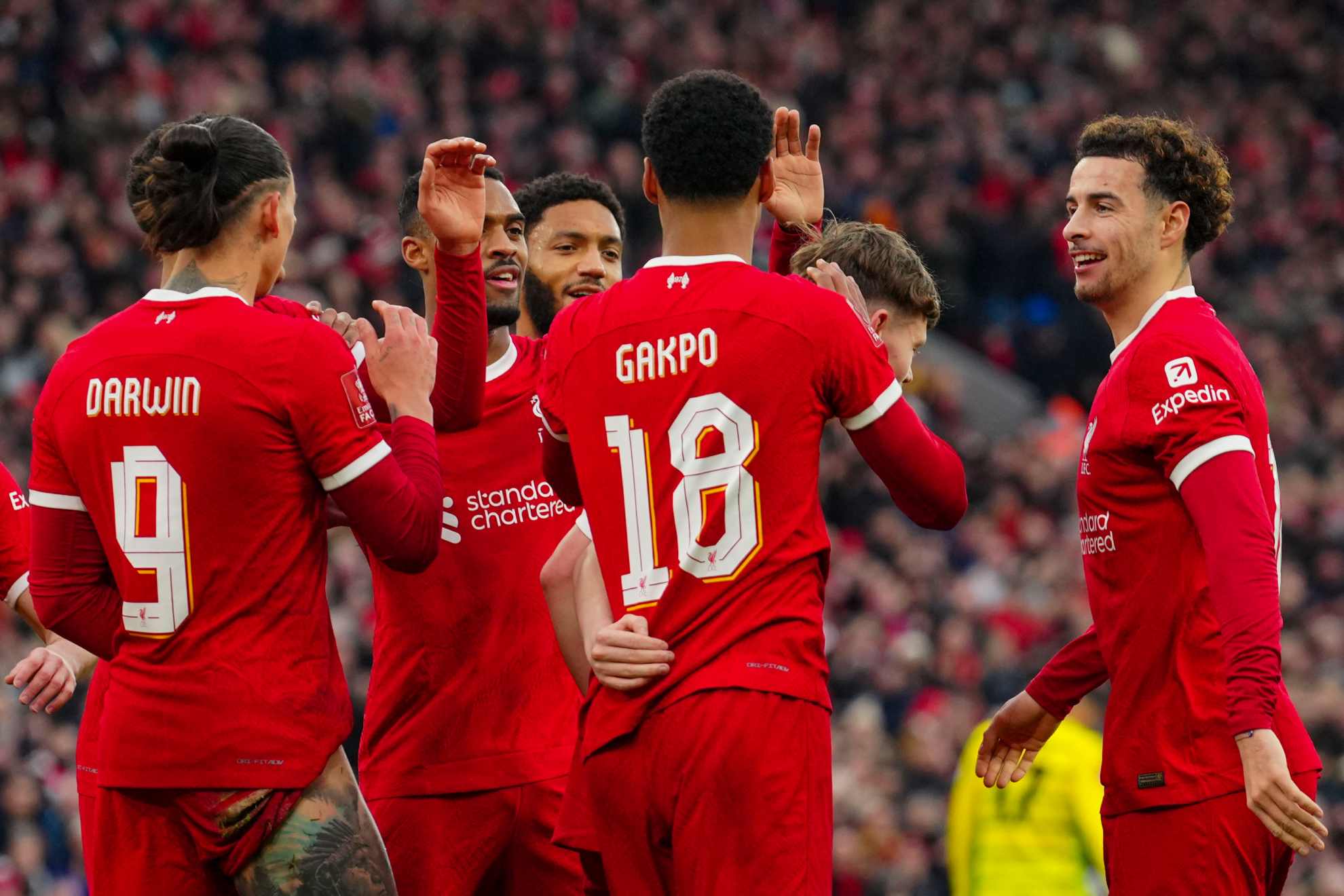 Liverpool players celebrate after scoring