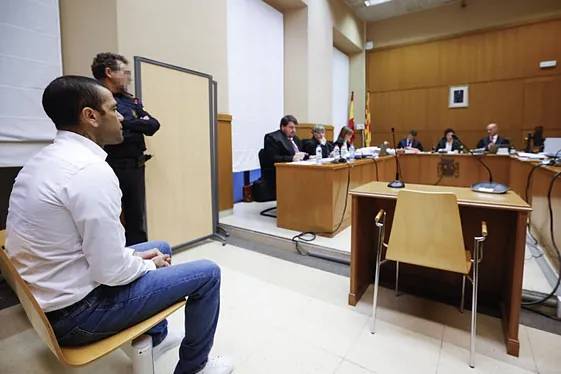 Brazilian soccer star Dani Alves sits during his trial in Barcelona