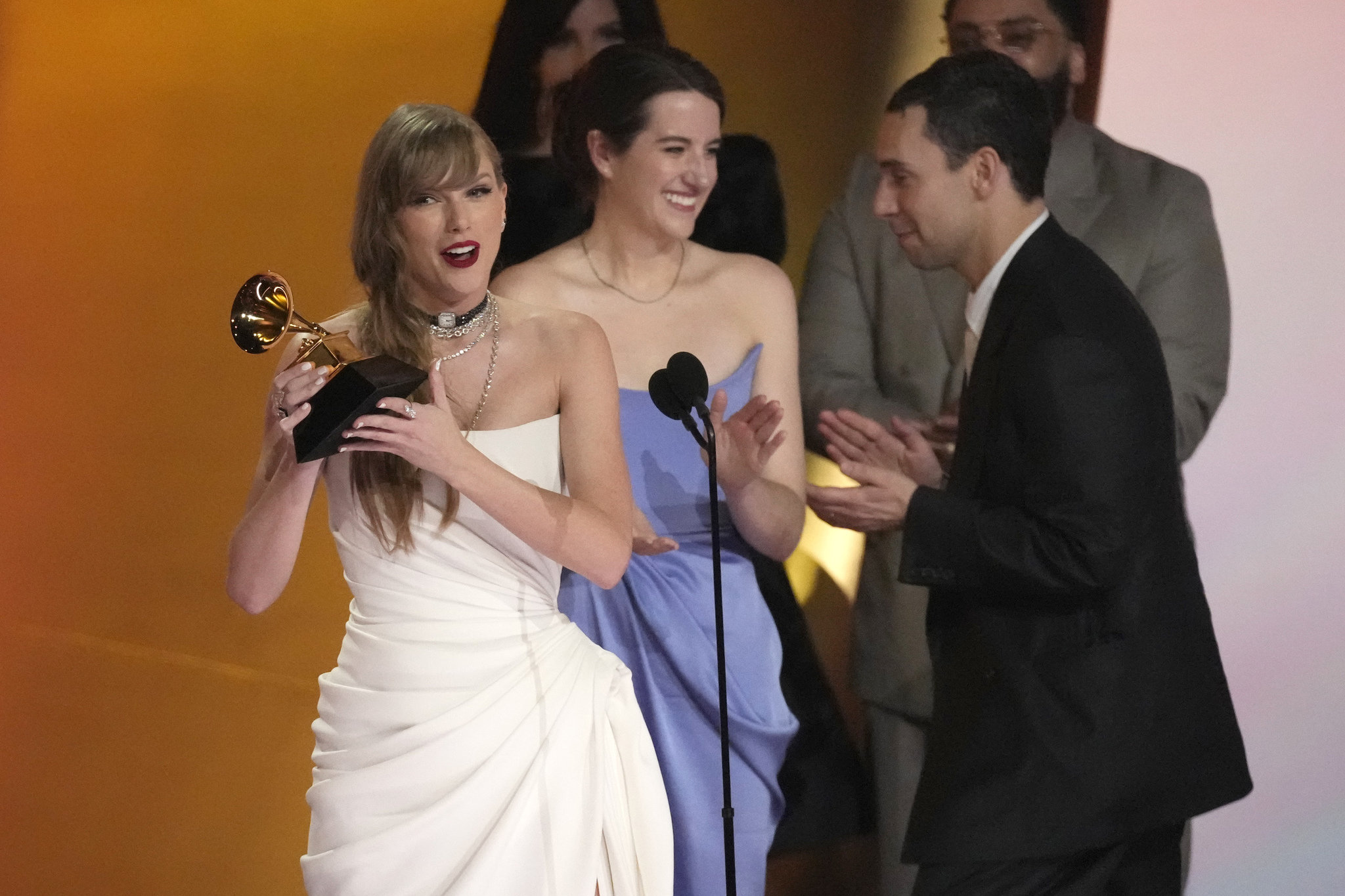 Swift collects her award.
