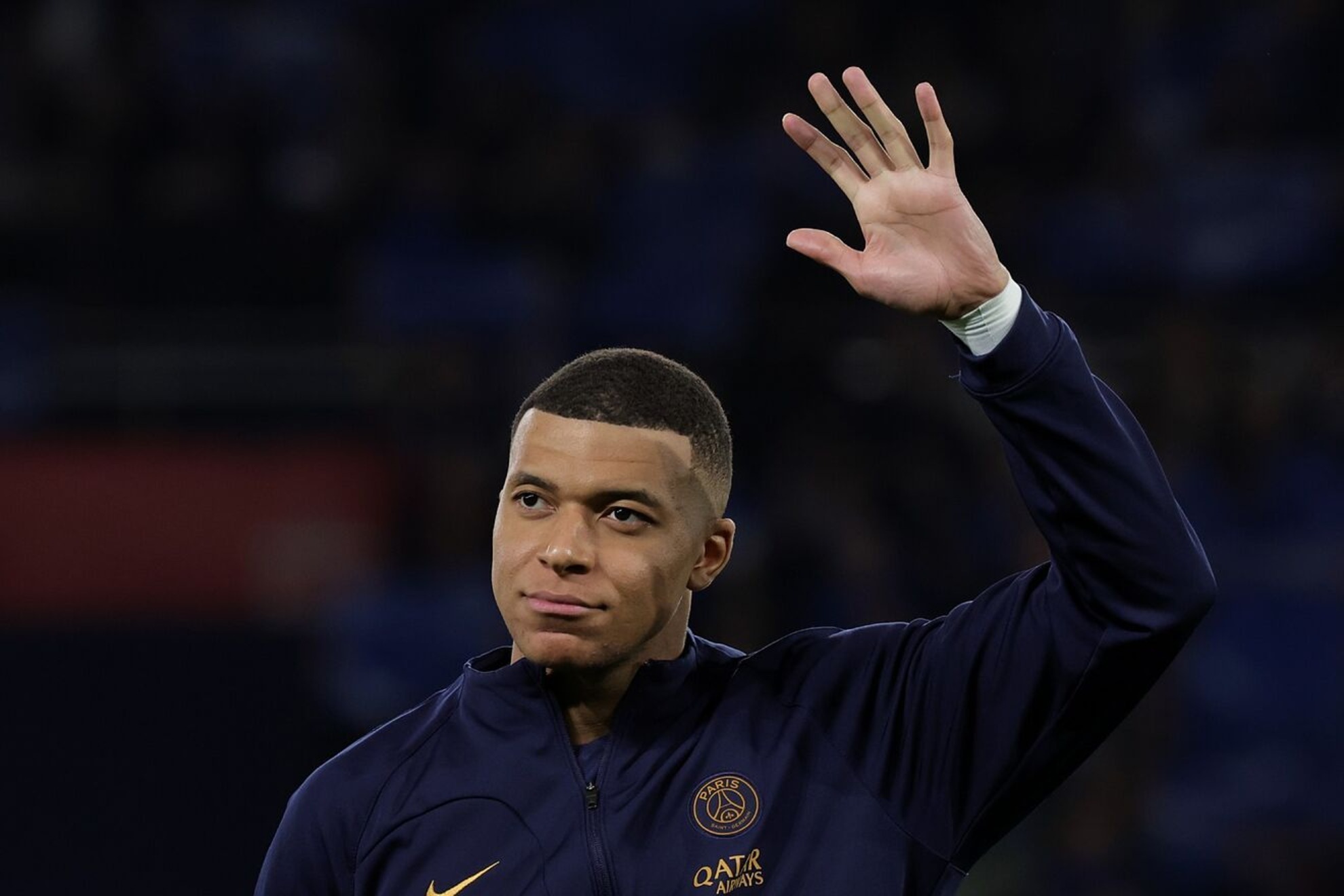 Kylian Mbappe waves to fans before the match against Real Sociedad