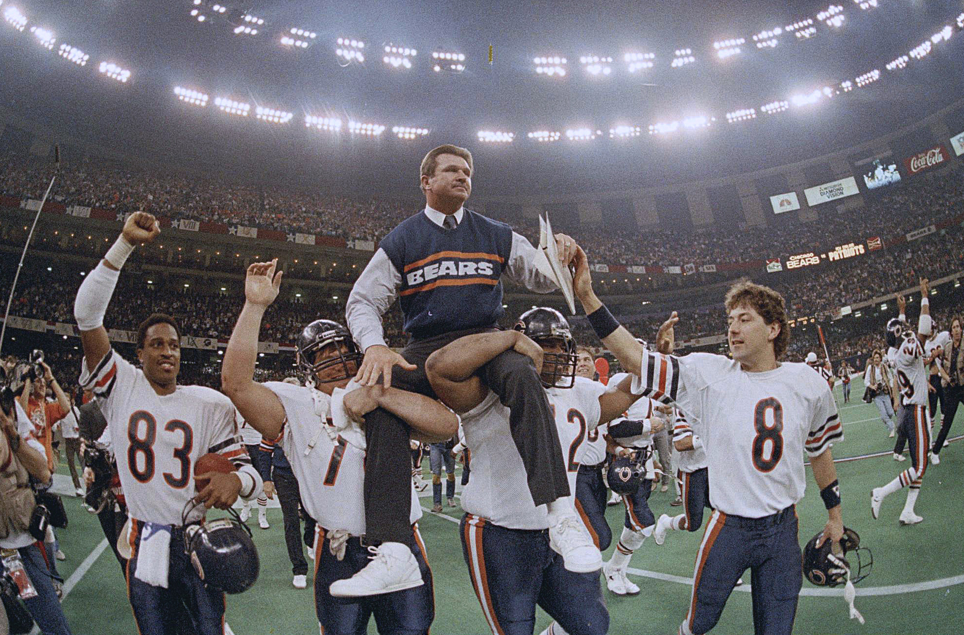 Steve McMichael carries his coach off the field