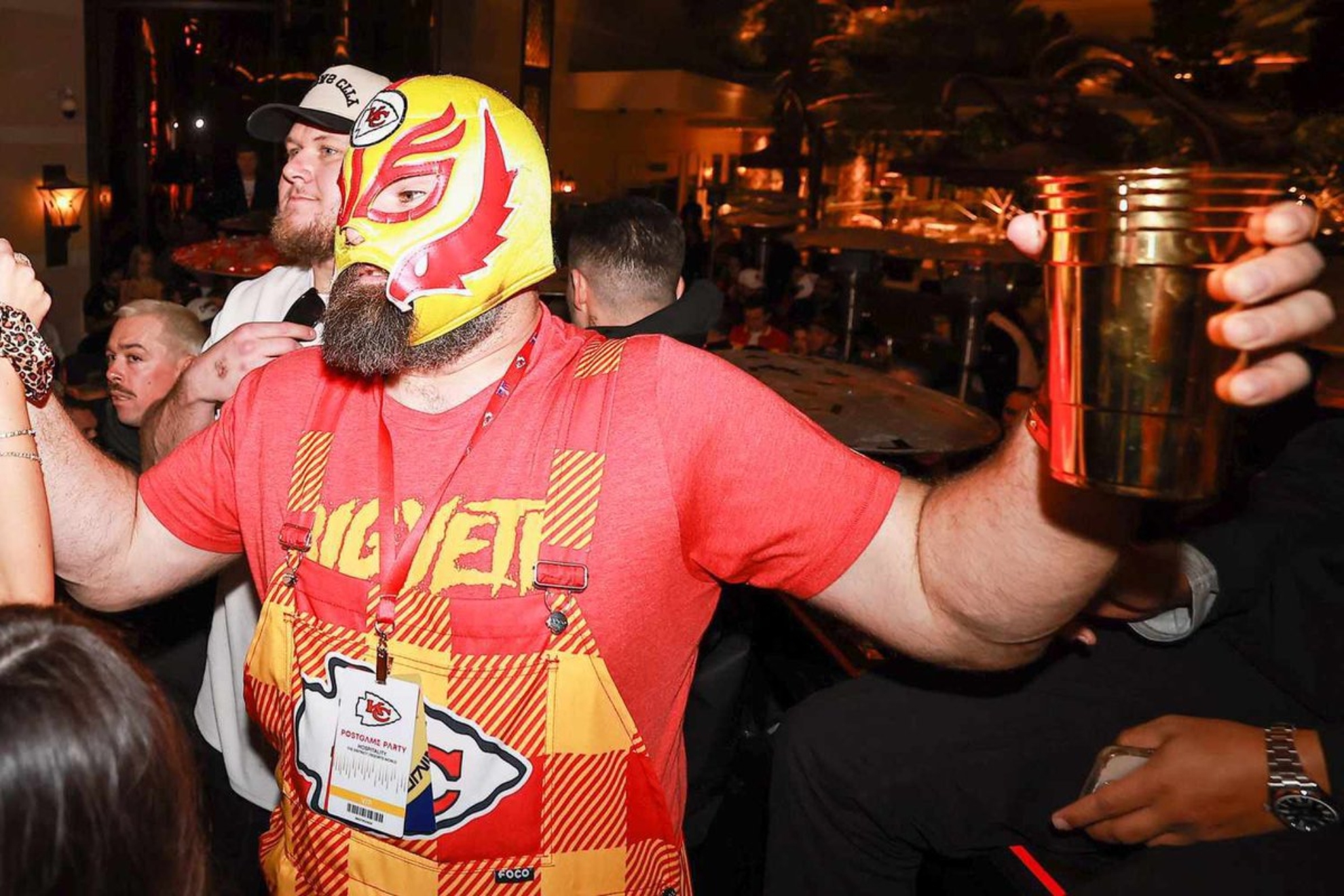 Jason Kelce in a Chiefs luchador mask