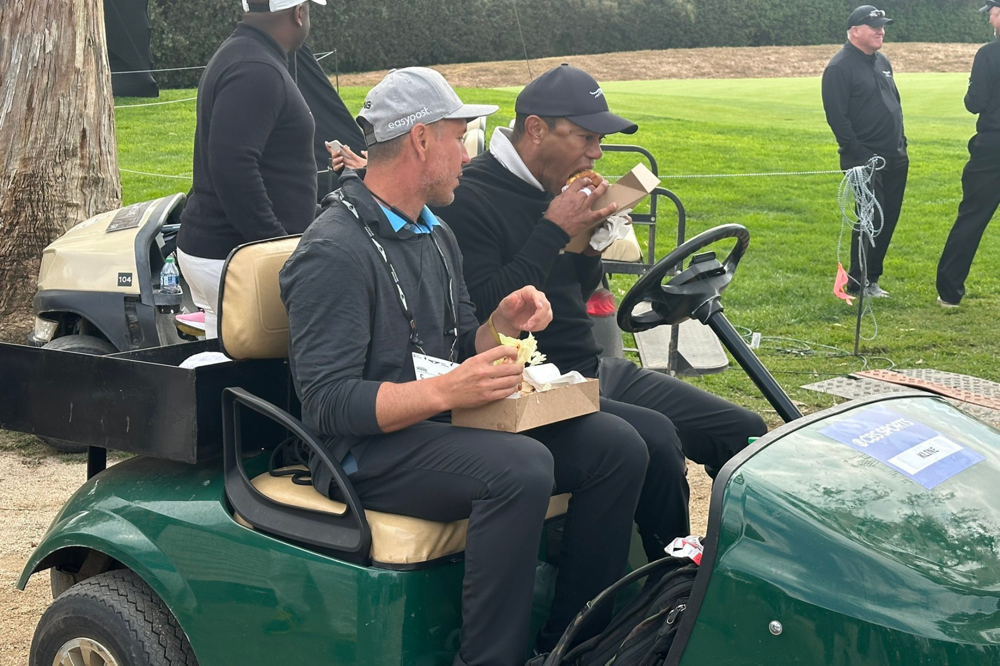 Tiger Woods consuming an In-N-Out burger.