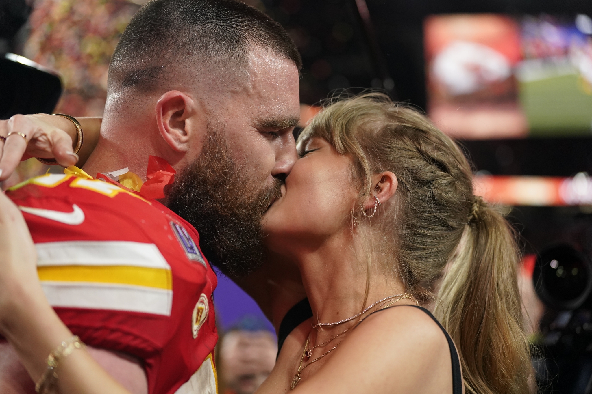 Taylor Swift kisses Kansas City Chiefs tight end Travis Kelce after the Super Bowl