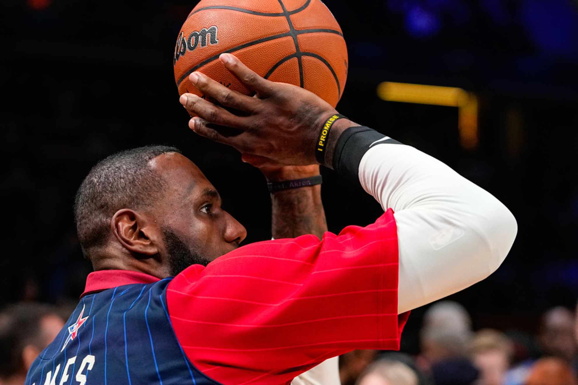 LeBron James (23) warms up before the start of the NBA All-Star basketball game in Indianapolis /