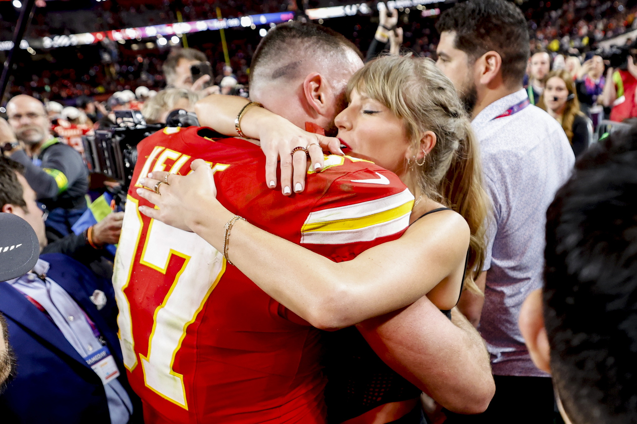 Kansas City Chiefs tight end Travis Kelce embraces Taylor Swift