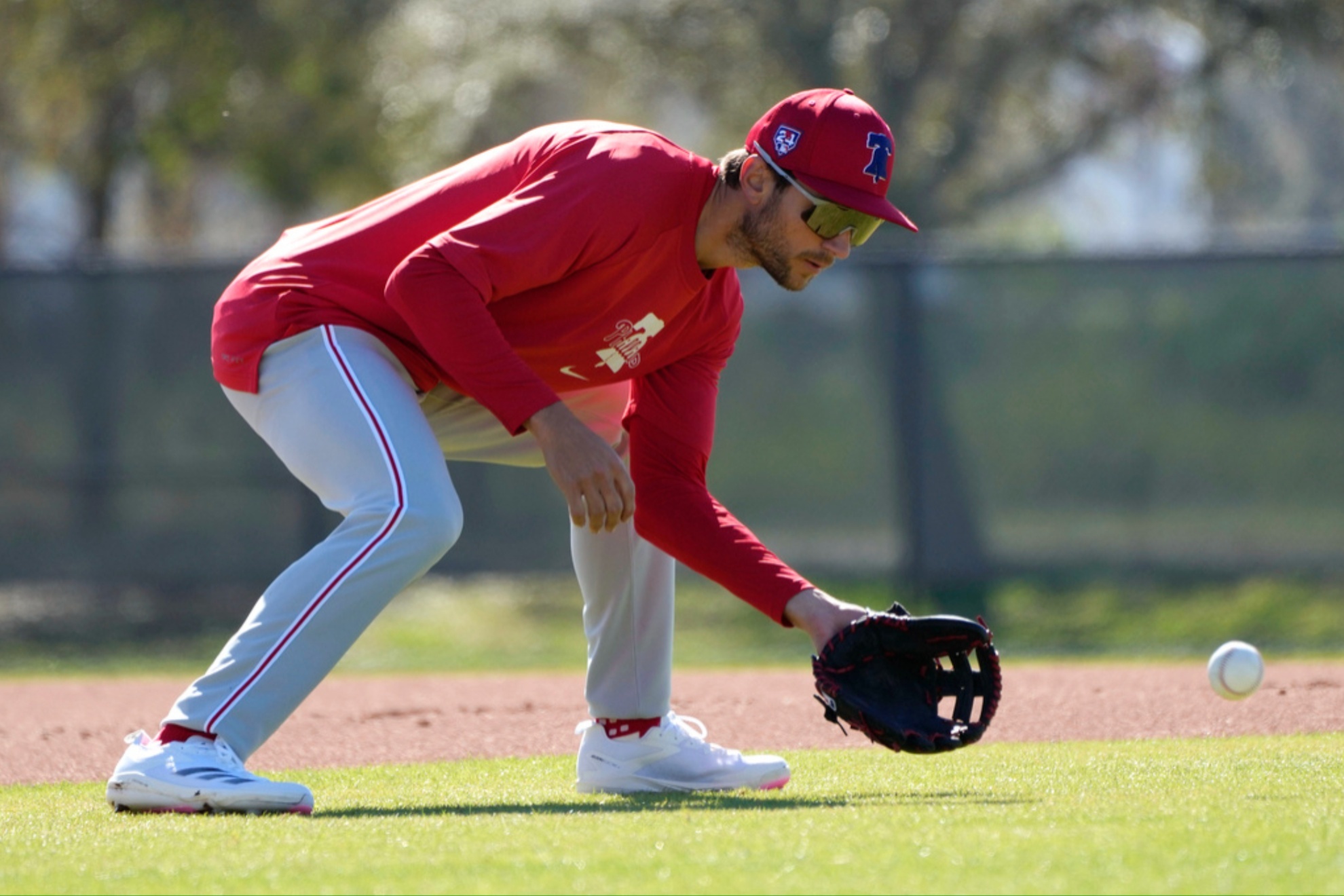 Trea Turner fields a ground ball during a baseball spring training.