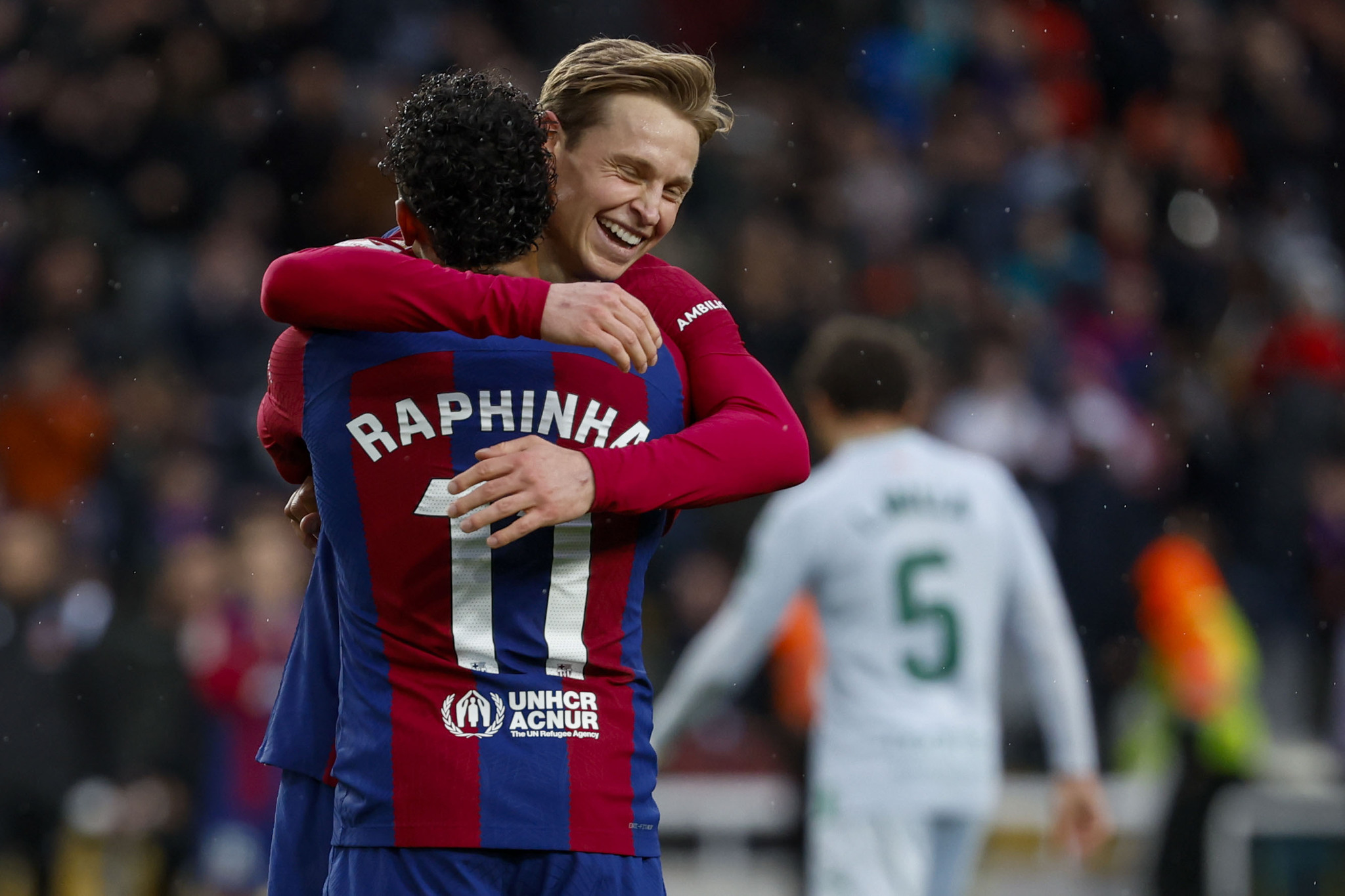 De Jong hugs Raphinha after scoring Barcelona's third of the game