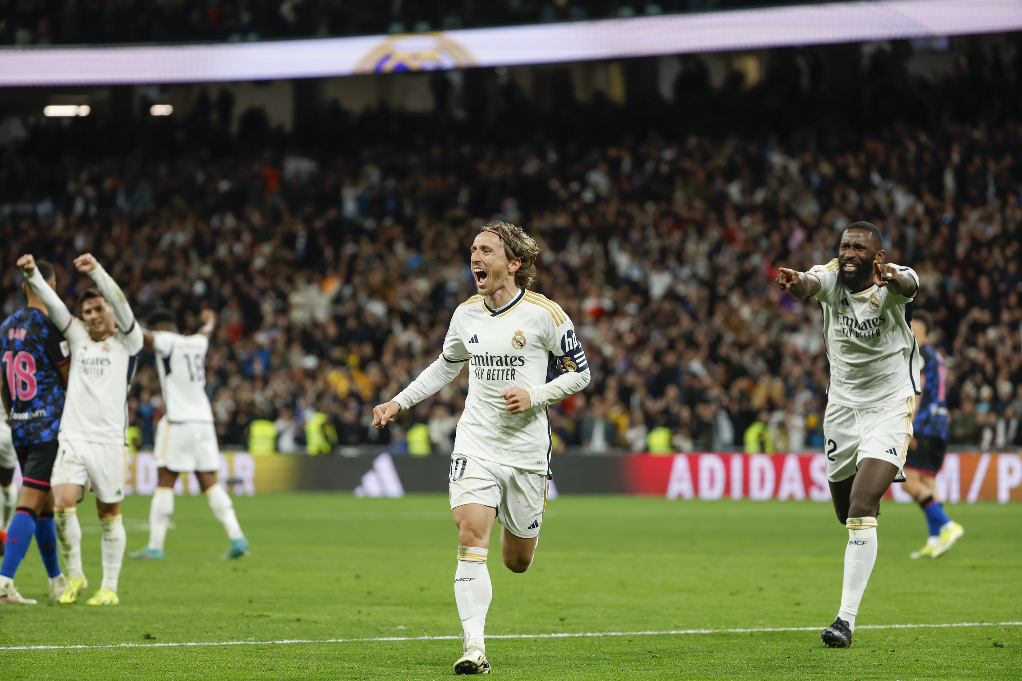 Luka Modric celebrates after scoring against Sevilla