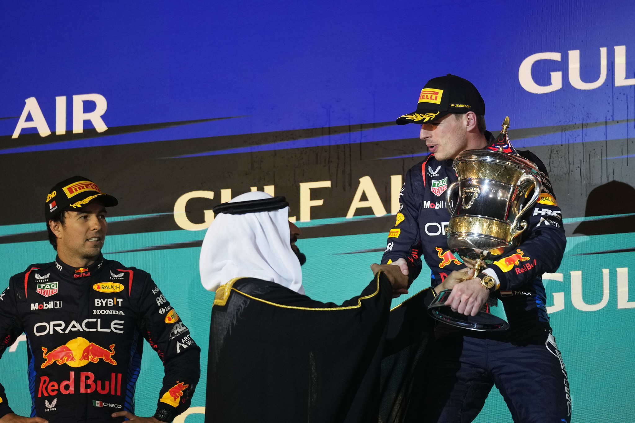 Max Verstappen receives his trophy on the podium