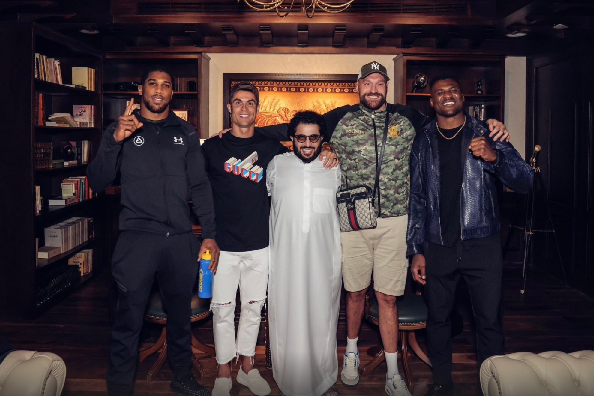 Anthony Joshua, Francis Ngannou, Tyson Fury, Cristiano Ronaldo and Turki Alalshikh posing for a picture