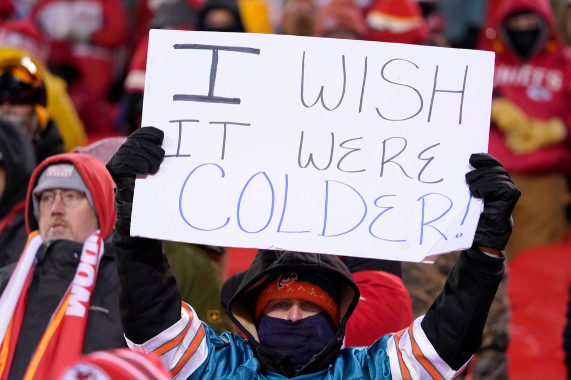 A Kansas City fan holds up a sign at the Chiefs-Dolphins AFC Wild Card game in January 2024