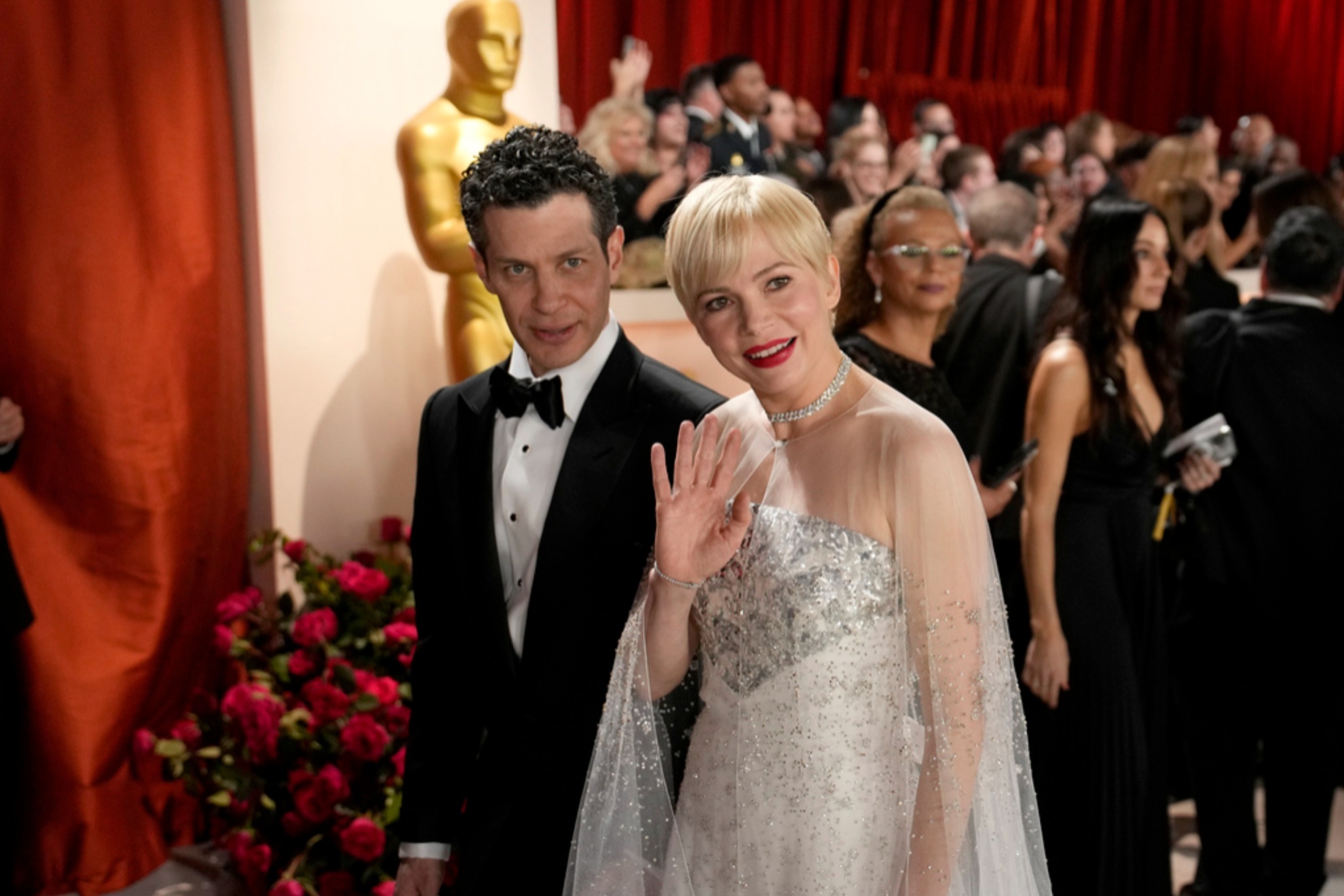 Thomas Kail, left, and Michelle Williams arrive at the Oscars on March 12, 2023
