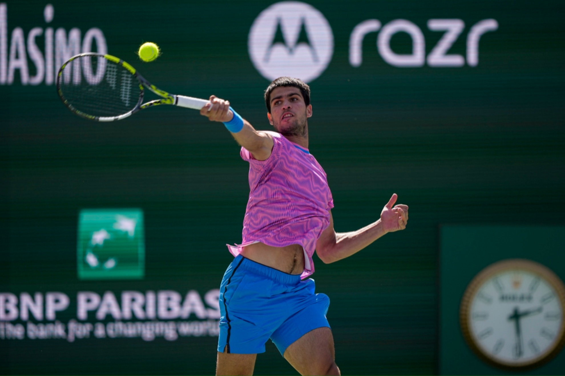 Carlos Alcaraz hits a return to Fabian Marozsan during their match at Indian Wells.